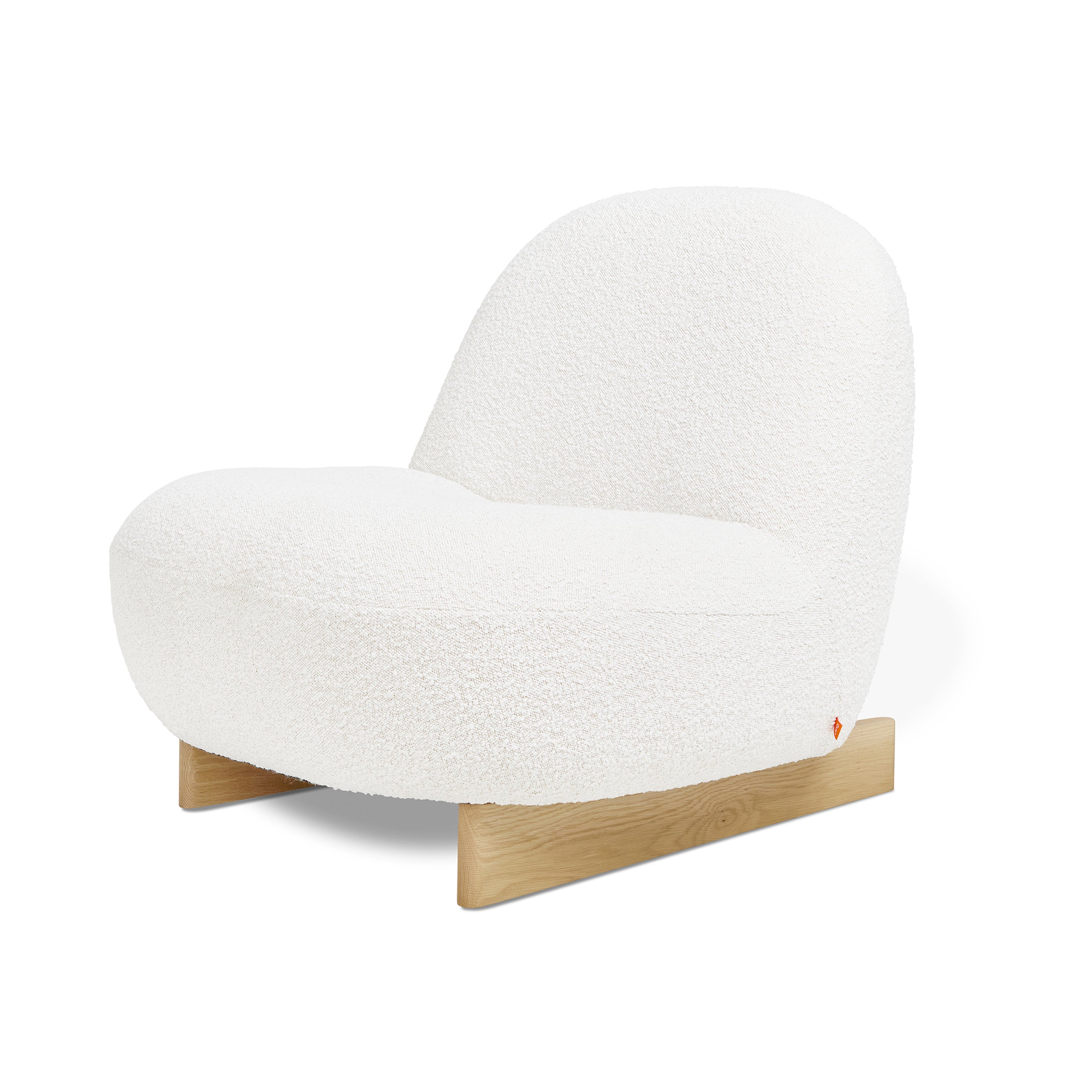 The Arlo Chair by Gus Modern features plush white bouclé upholstery, a rounded backrest, and a light wooden base with flat legs—an inviting piece inspired by Scandinavian design.