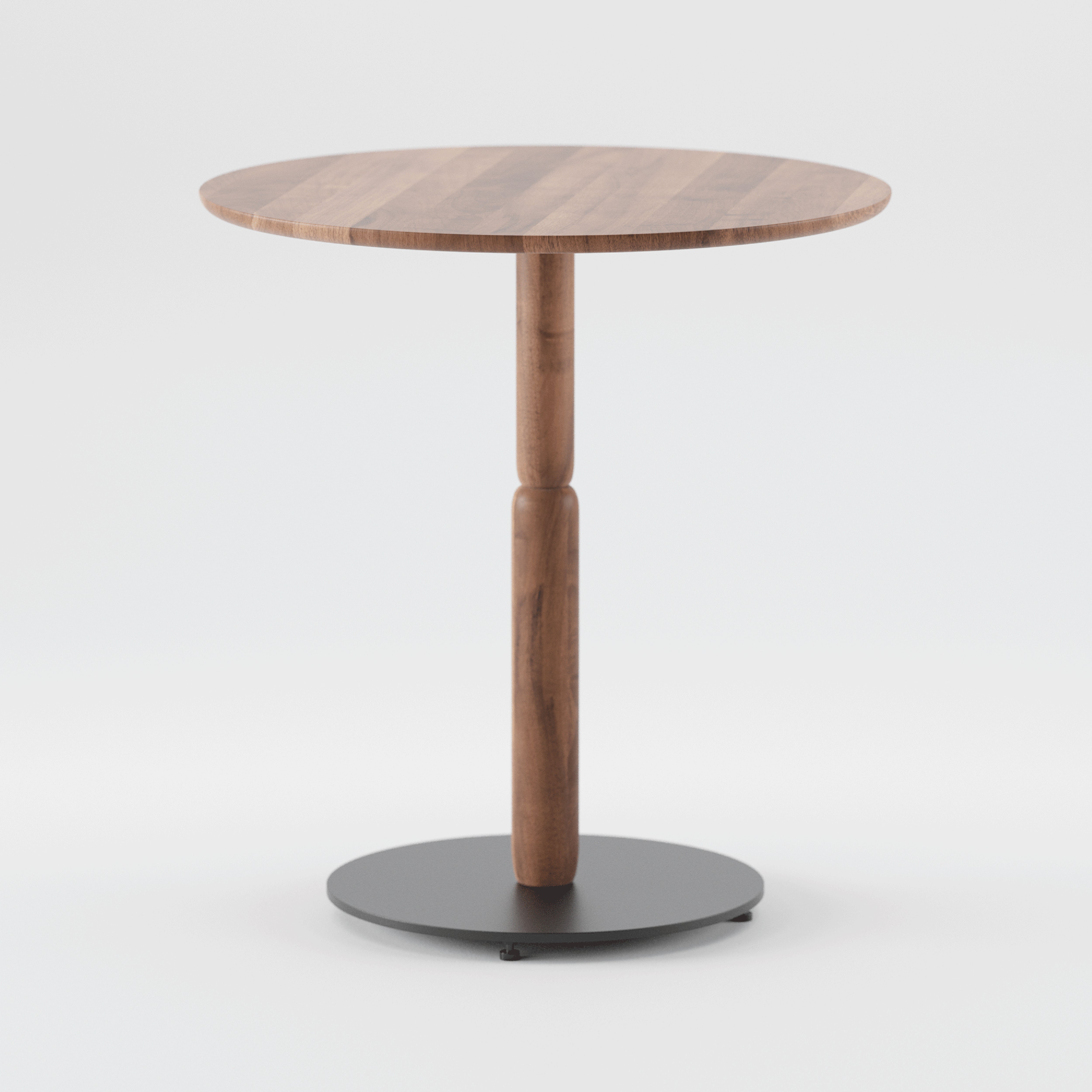 The Artisan Bistro A Table is a round wooden table made from solid wood with a smooth finish, featuring a single central wooden pedestal and a circular black metal base, showcased against a plain white backdrop.