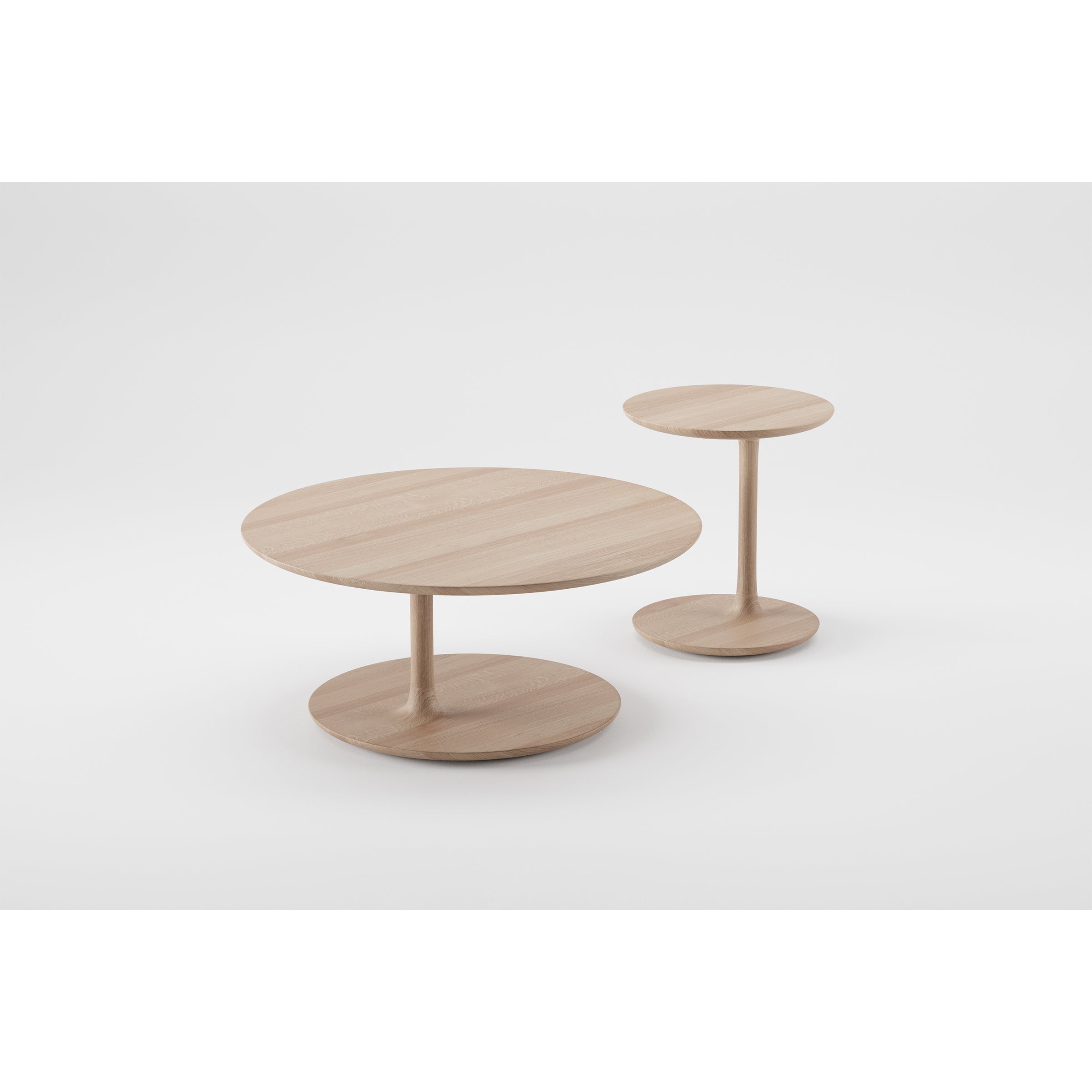 Two wooden round tables from Artisans BLOOP collection are set against a white background. With flat circular tops and bases linked by a central column, they present a simple, modern design crafted using advanced 5-axis technology.