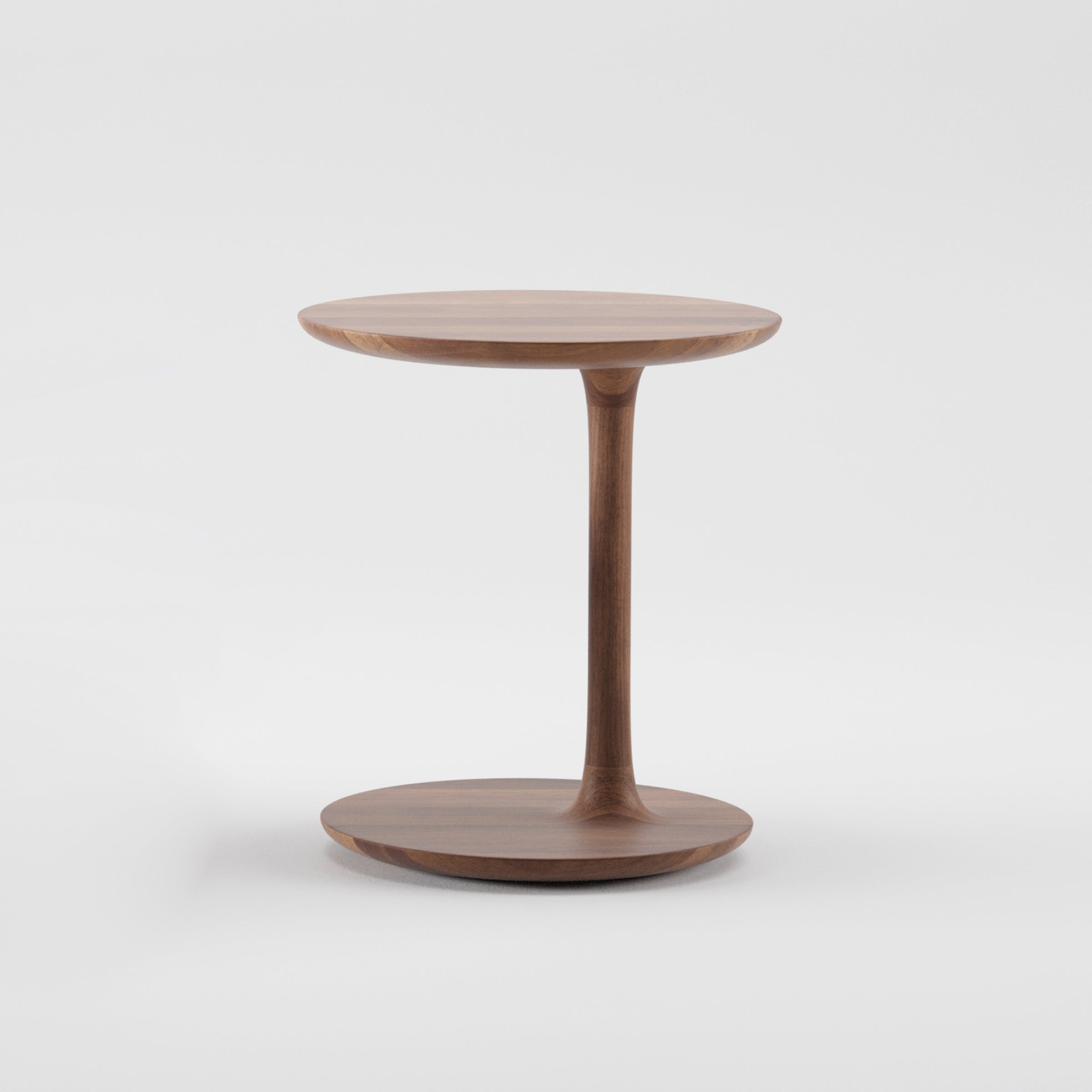 From the Bloop Collection by Artisan, the minimalist BLOOP Coffee Table showcases a circular top and base, crafted with 5-axis technology. A smooth, tapered stem seamlessly connects the pieces, featuring a natural finish and simple modern design against a plain white backdrop.