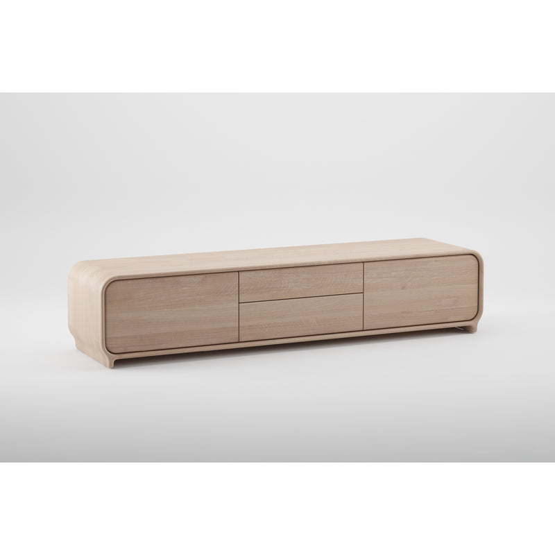 The ENY Lowboard by Artisan is a minimalist media console made from solid, eco-friendly wood, featuring three drawers and two cabinet doors with smooth, rounded edges. It is elegantly showcased against a plain white background.