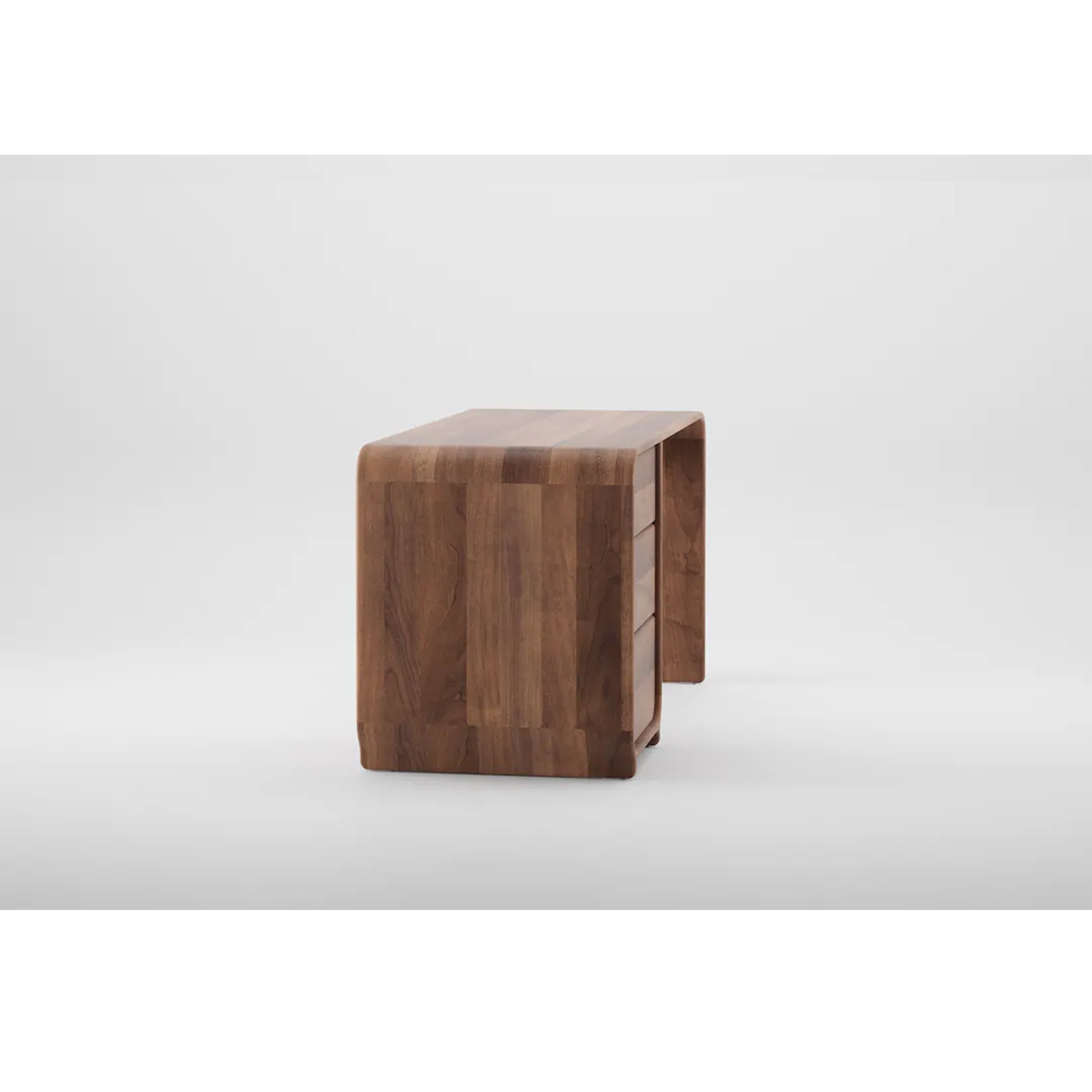 The ENY Working Desk by Artisan features a minimalist design crafted from solid wood with natural oils. It includes three drawers on one side, showcasing visible grain patterns and rounded edges, enhancing its modern look against a plain white background.