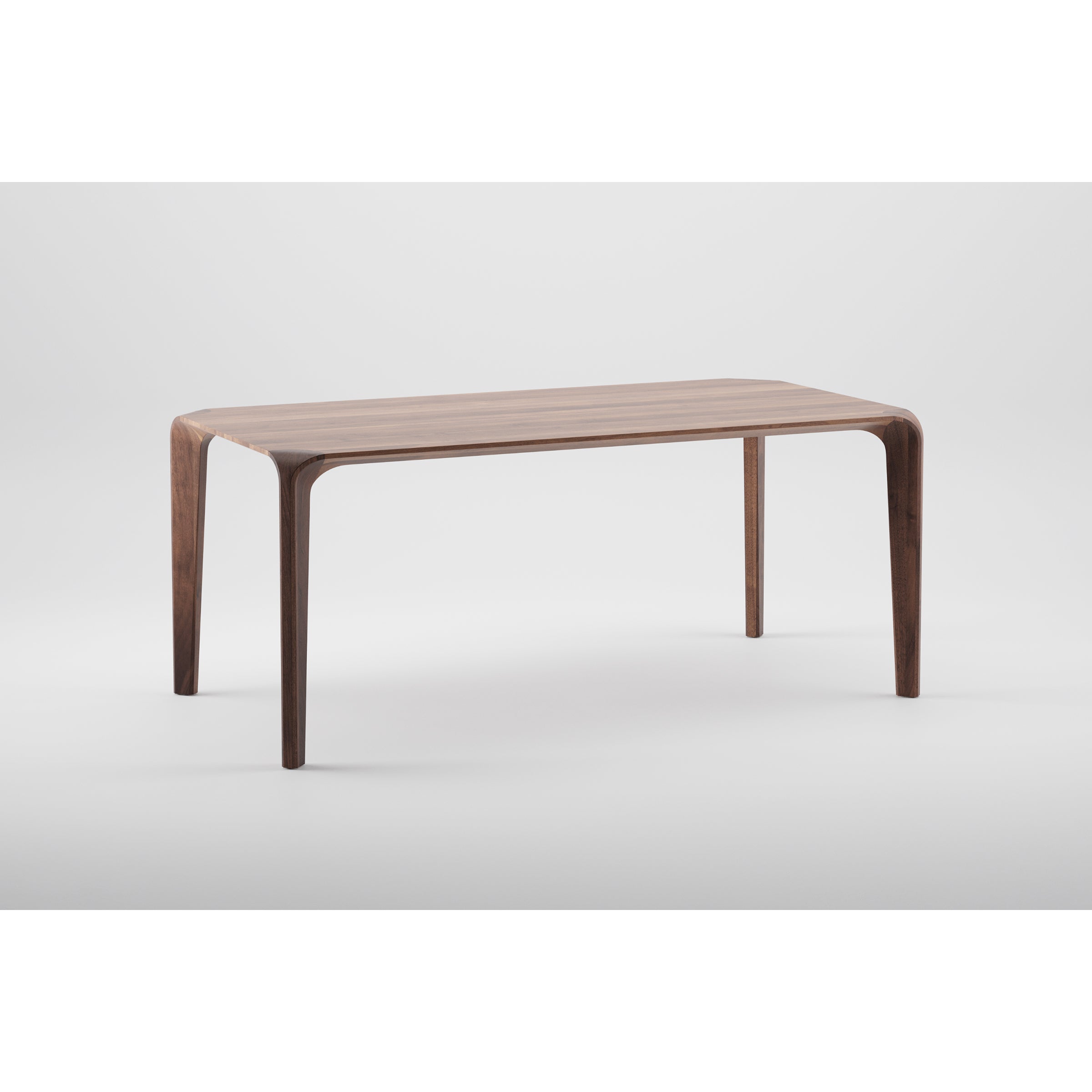 The Artisan FLOW Table, a sleek, minimalist piece crafted from solid wood, boasts a smooth rectangular top and gently curved legs. Finished with natural oils to enhance its modern design, it stands elegantly against a plain white background, embodying an eco-friendly aesthetic.