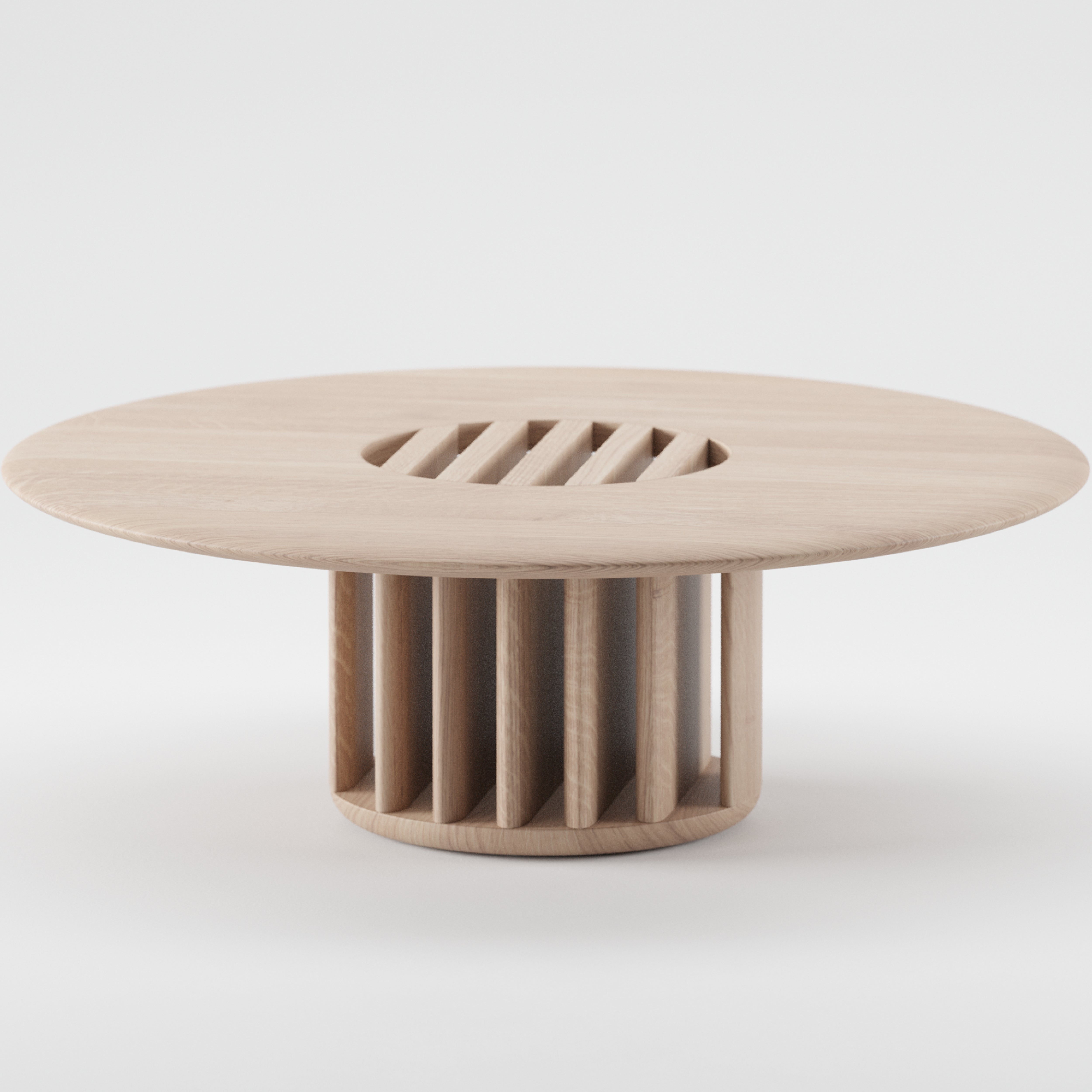 The GRID Coffee Table by Artisan is round with a smooth top and unique slatted circular design. Made from sustainable materials, it features vertical wooden slats for the base and an eco-friendly light natural wood finish.