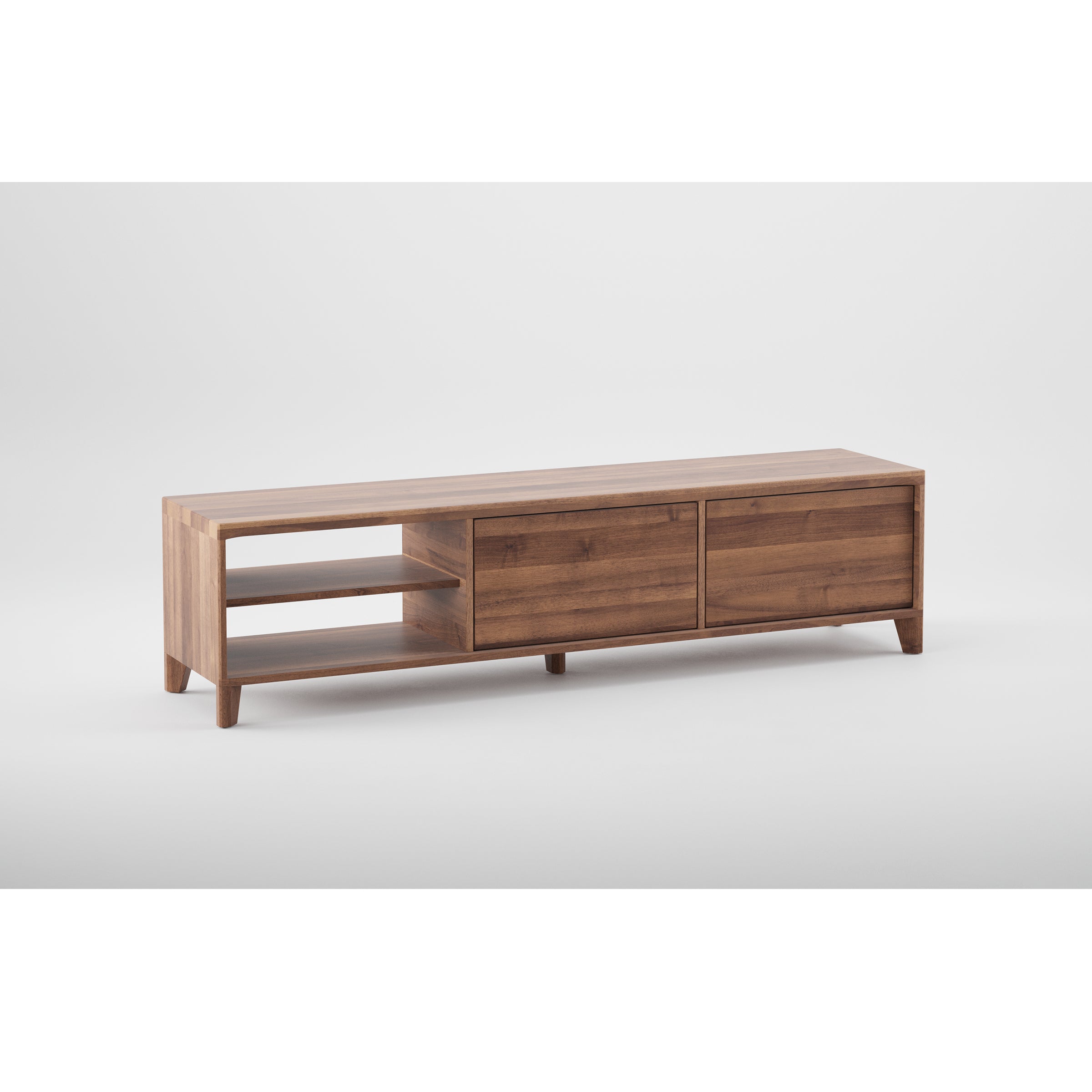 The HANNY Lowboard by Artisan is a minimalist wooden TV stand with two right-side cabinets and two left-side open shelves, crafted from eco-friendly materials. It features a natural wood texture, sleek finish, and four short legs.