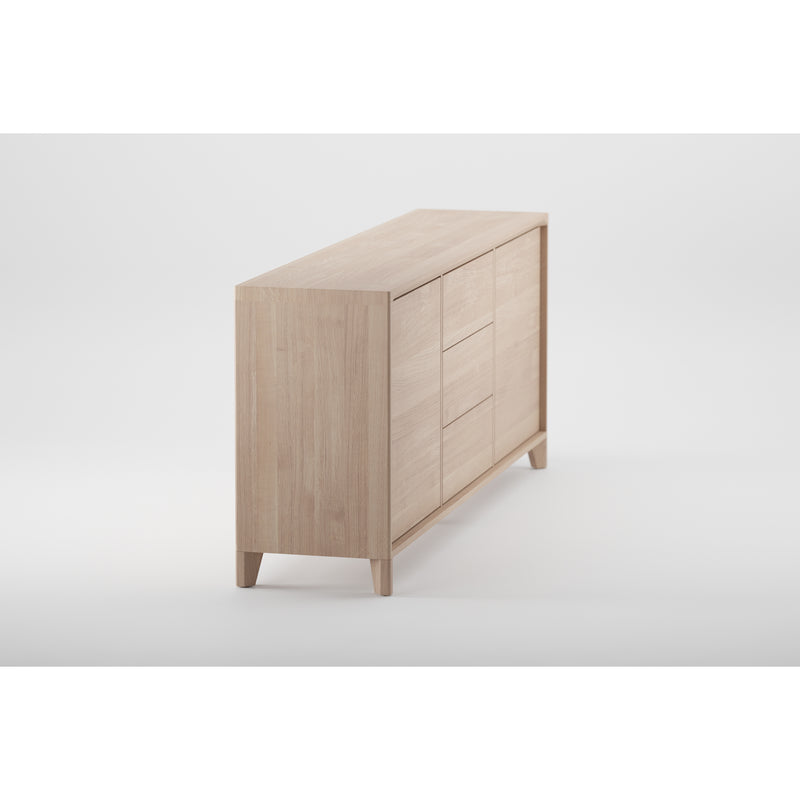 The Artisan HANNY Sideboard, set against a white background, highlights its sleek minimalist design made from solid wood. The light finish, enhanced by natural oils and wax, features clean lines and four sturdy legs for an eco-friendly storage solution.