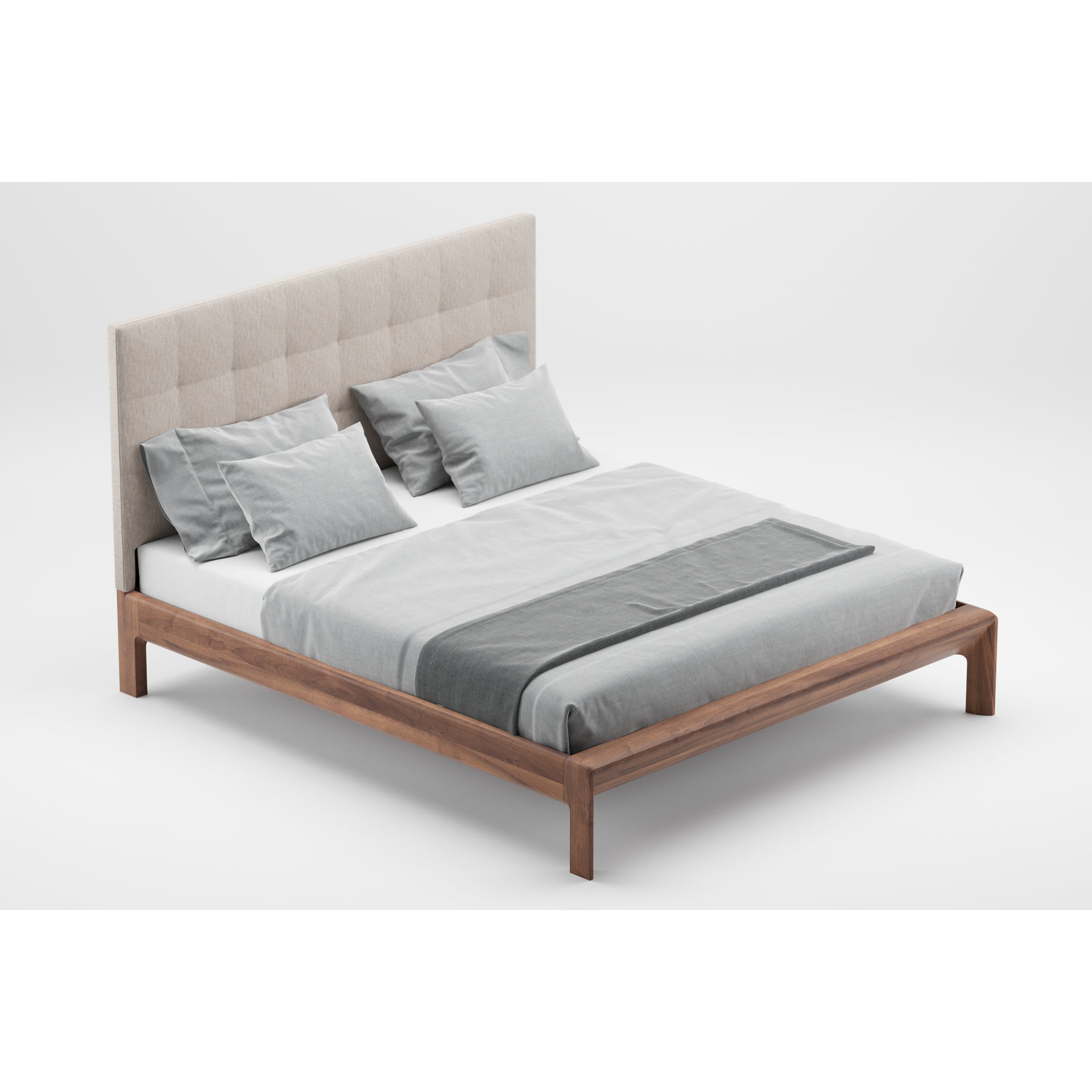 The Artisan INVITO Bed is a modern wooden bed crafted from solid wood with a high, upholstered headboard. It features gray and white bedding, including pillows, sheets, and a comforter. Set against a plain white background, it showcases its premium American walnut finish.