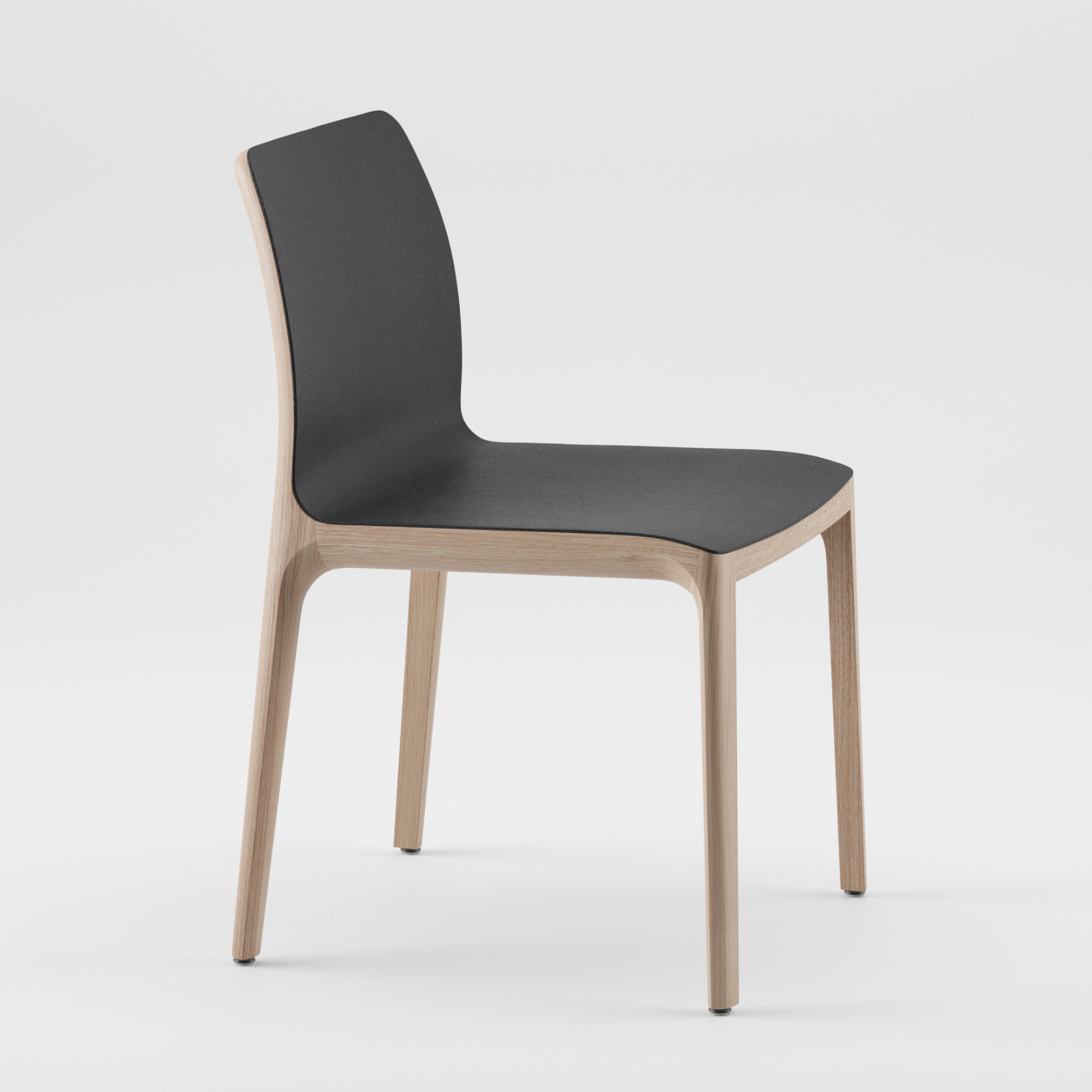 The INVITO Chair by Artisan features a sleek black seat and backrest paired with light solid wood legs and frame. Crafted from eco-friendly materials, its minimalist design stands out elegantly against a plain white background.