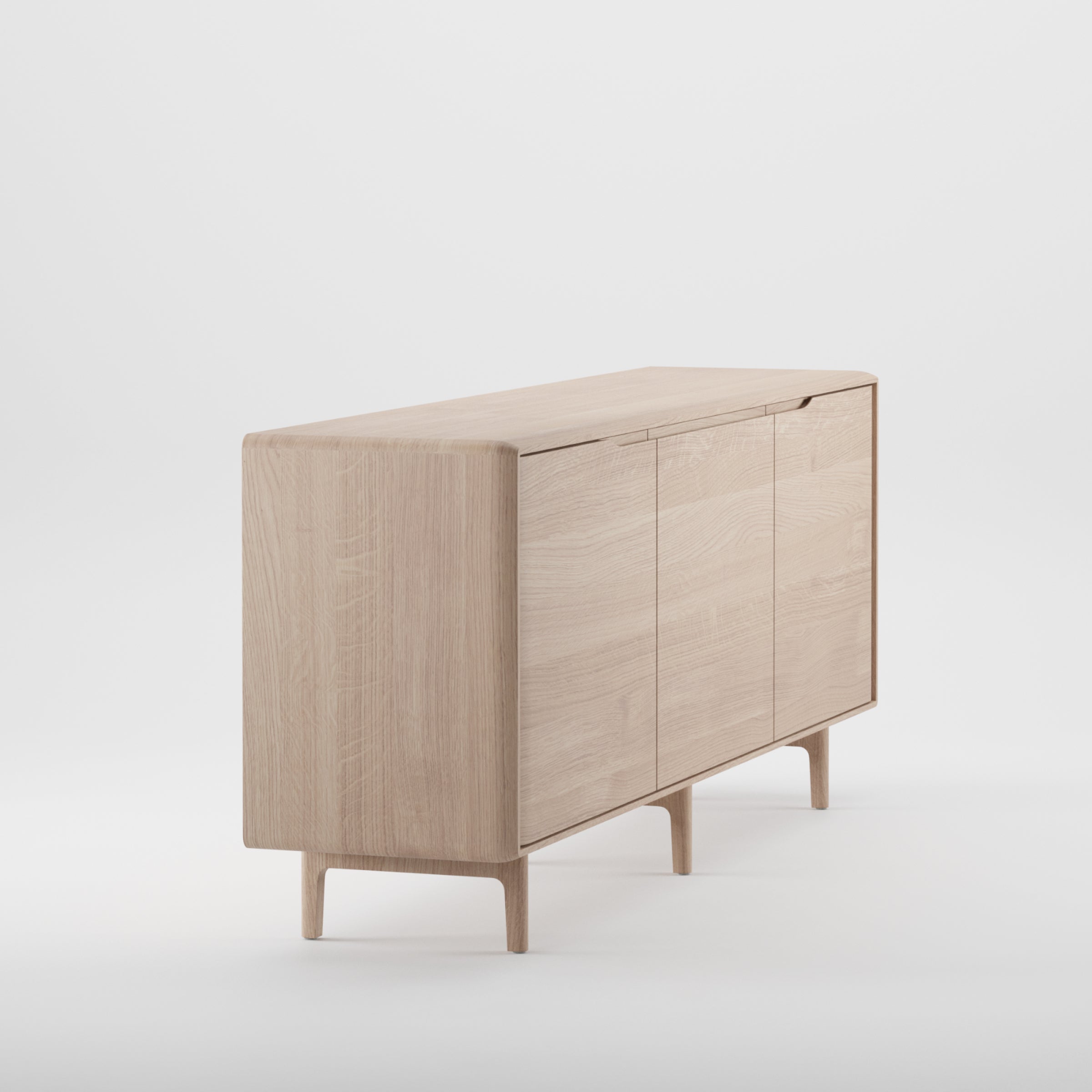 The INVITO Sideboard by Artisan is a minimalist piece crafted from solid light wood. Featuring four cabinet doors and sleek legs on a plain white backdrop, it highlights clean lines, a smooth finish, and eco-friendly materials for enhanced sustainability.