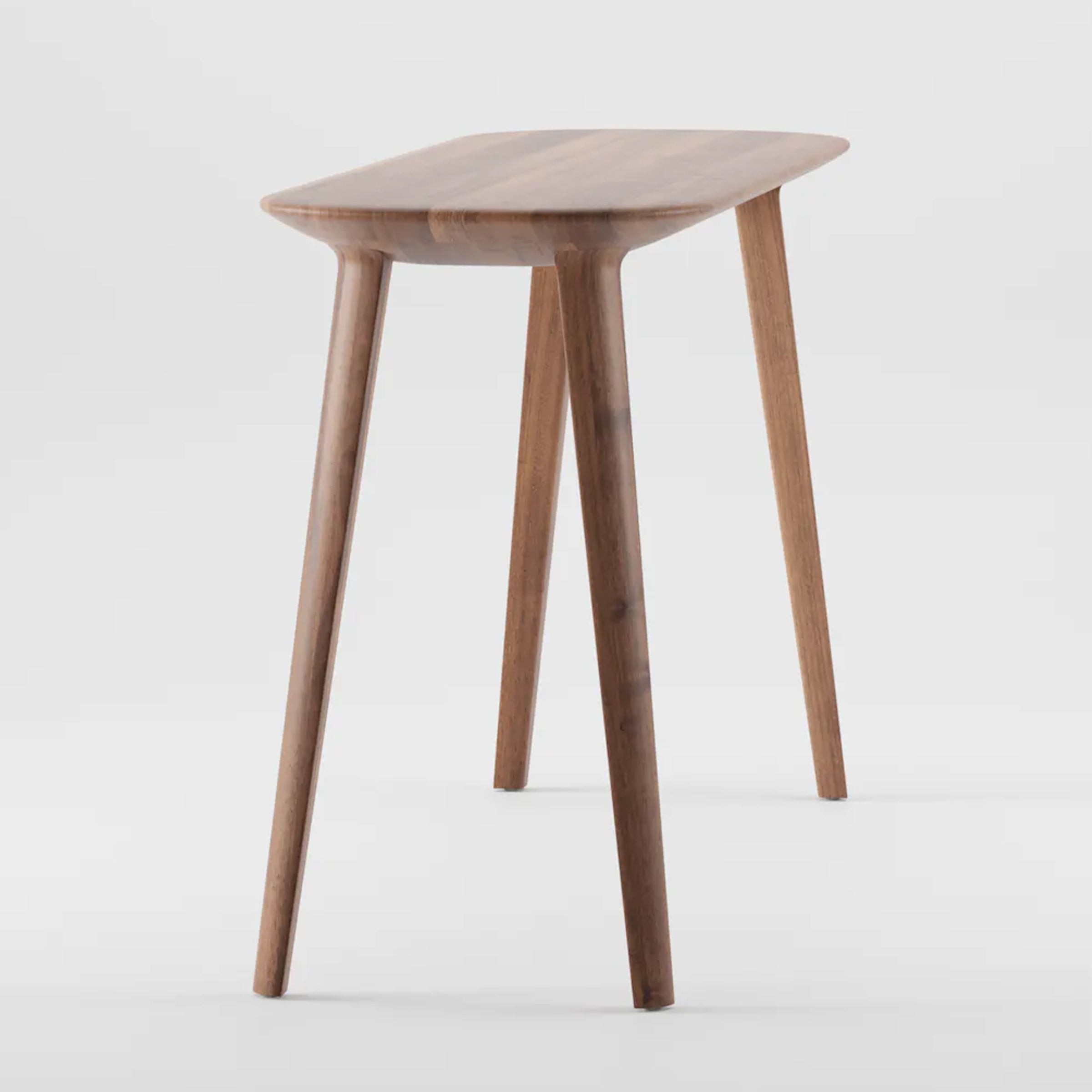 The Artisan KALOTA Console Table by Neisako is a sleek, modern wooden piece featuring a smooth, rectangular tabletop and gently tapering, angled legs on a white background that accentuates its rich wood texture.