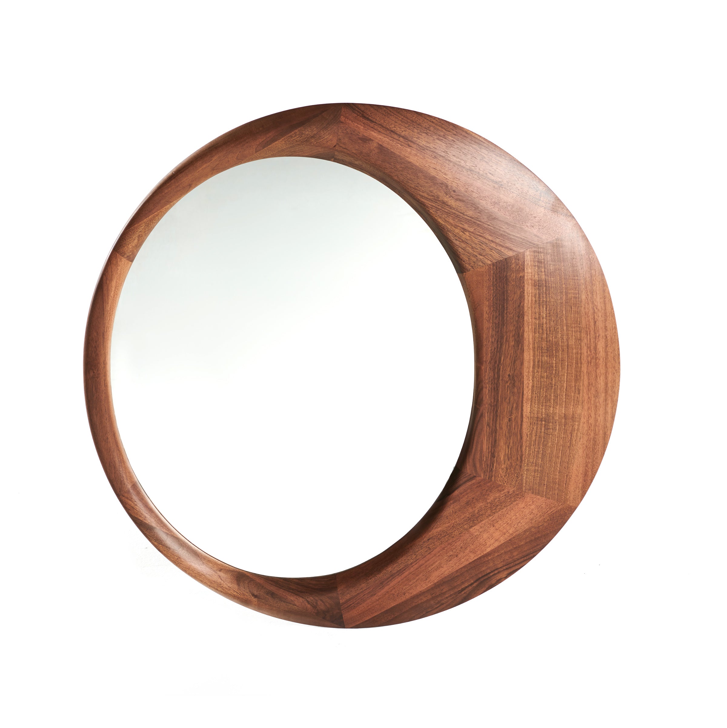 The Lana Mirror by Artisan features a round design with a thick, textured wood frame made from solid wood and natural oils. It has a dark brown finish with a polished surface, centering a mirror that contrasts beautifully against a plain white backdrop.
