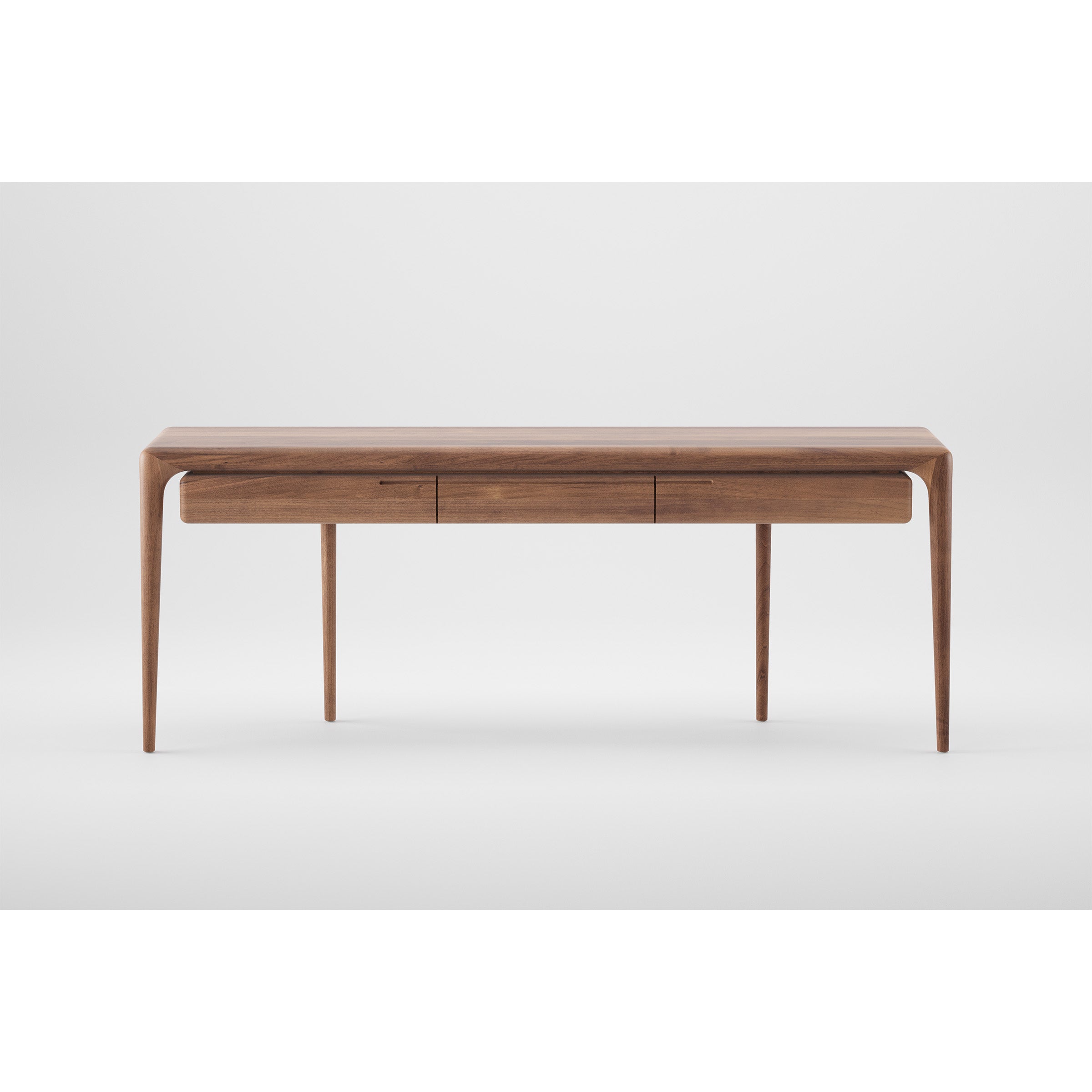The LATUS Console table by Artisan is a wooden desk with a minimalist design featuring four tapered legs. Its crafted from solid wood and eco-friendly materials, showcasing a long tabletop with two drawers underneath and finished with natural oils for a rich look against a plain white background.
