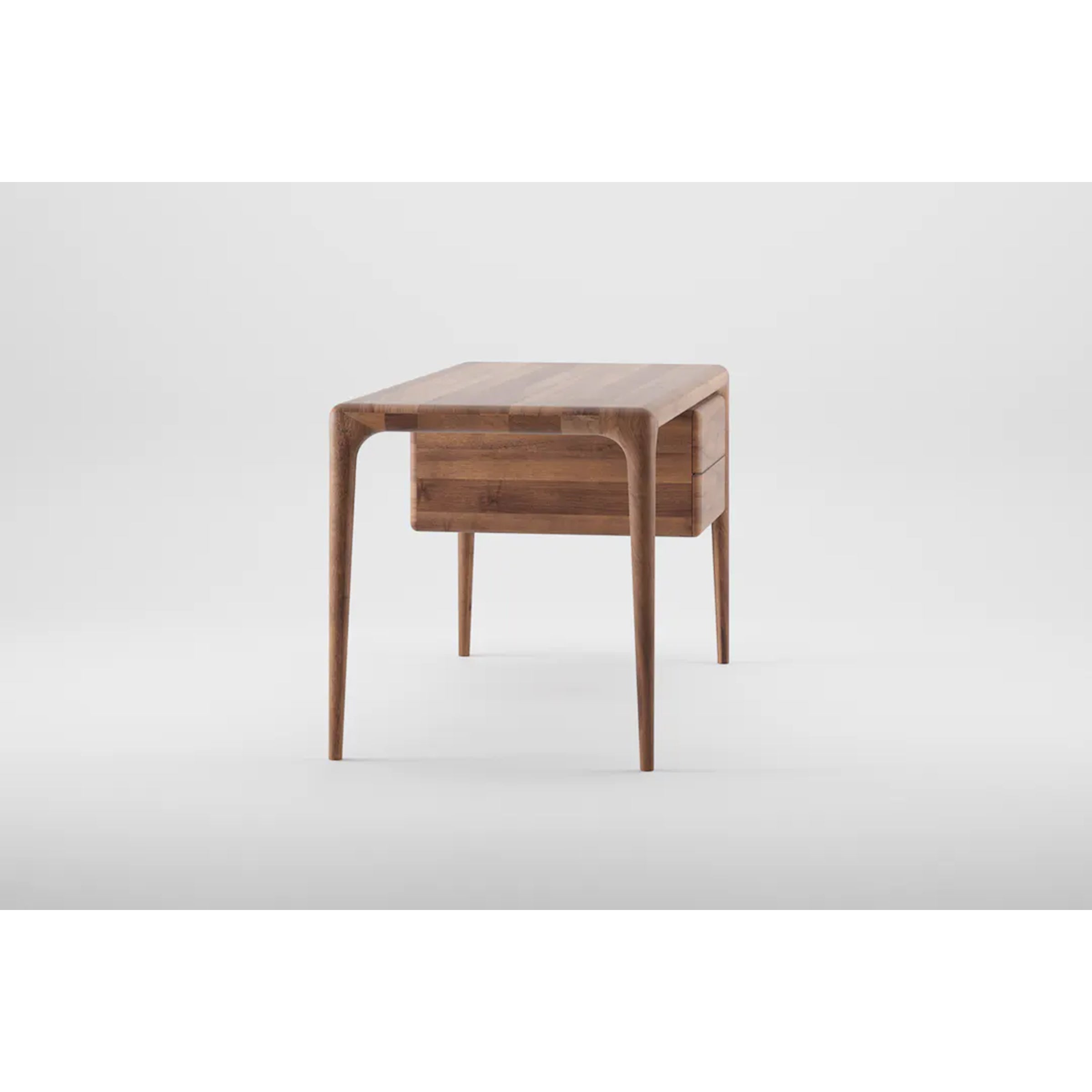 The Artisan LATUS Desk boasts a sleek, modern look with its solid wood construction and slim, tapered legs. Its minimalist design and smooth finish highlight its organic beauty, creating a contemporary feel against a light gray backdrop.