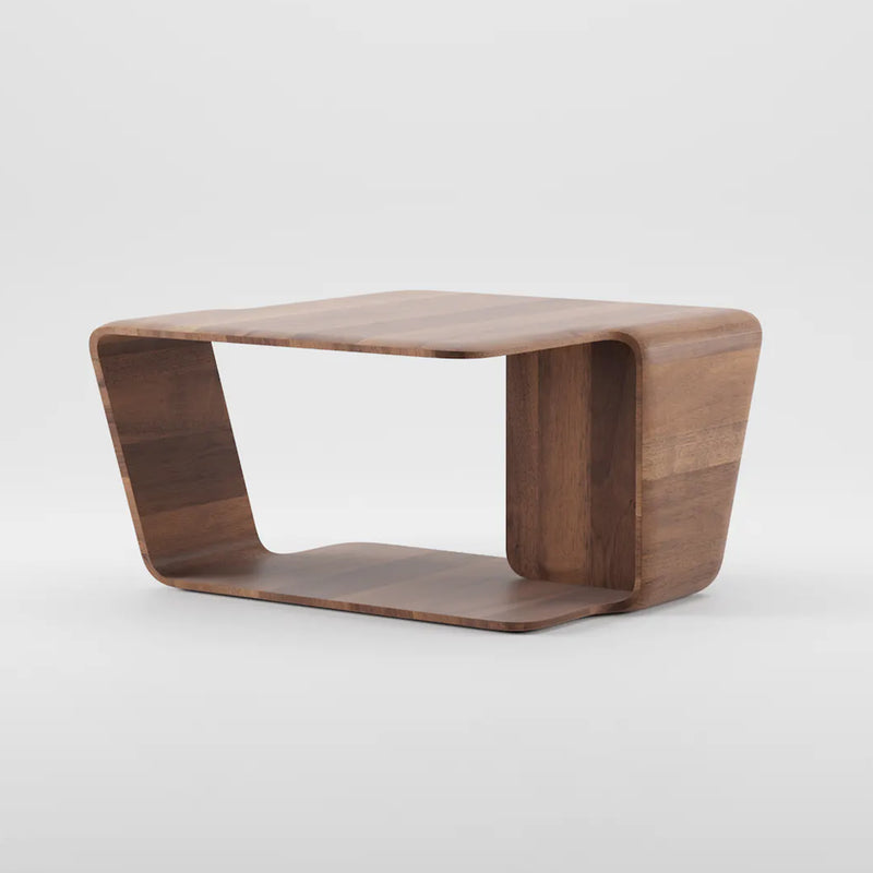 The Mars Coffee Table by Artisan is a modern side table with curved corners and an open rectangular base, crafted from solid wood treated with natural oils. It features a smooth, polished finish that highlights its natural grain while being environmentally friendly.