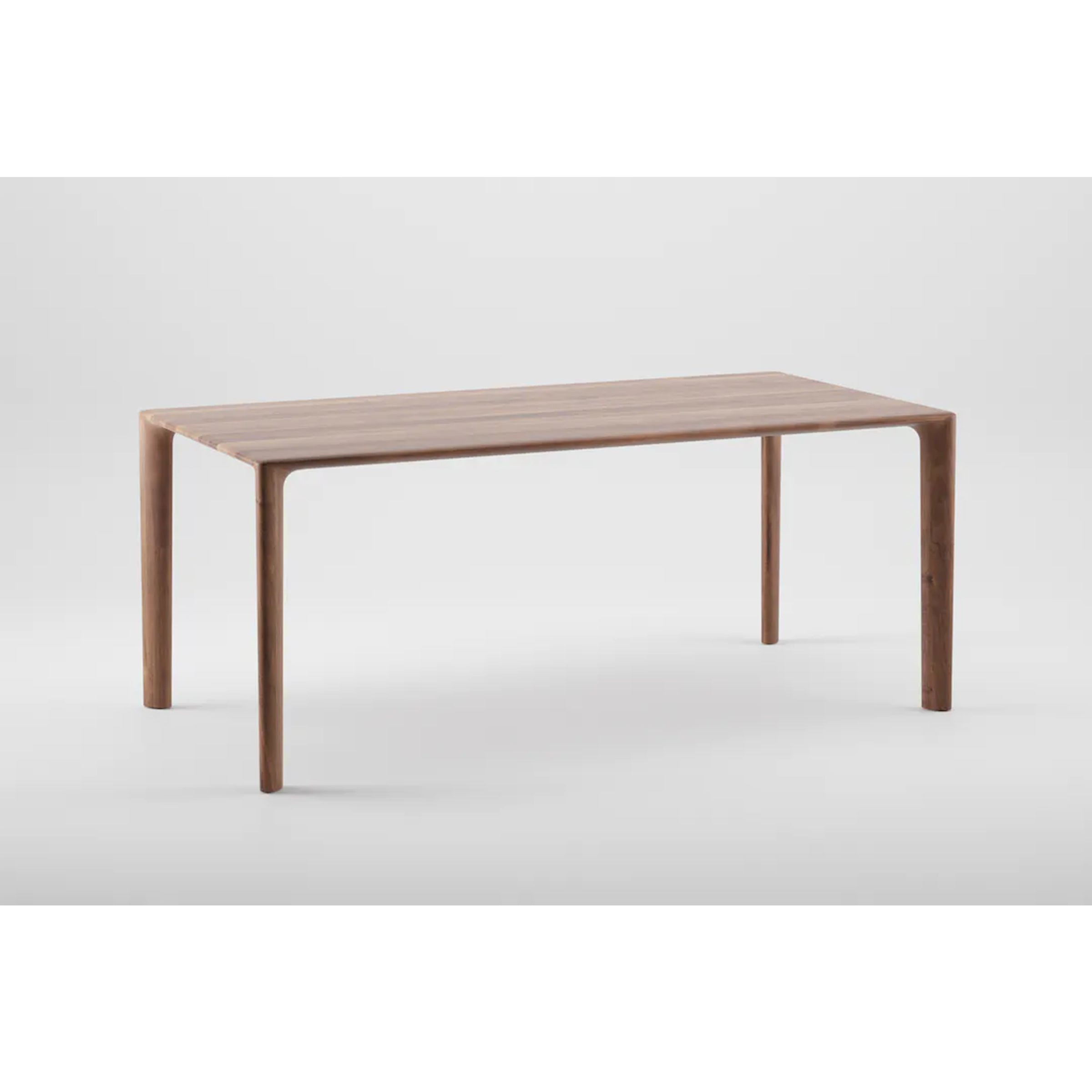 The MELA Table by Artisan is a minimalist piece crafted from solid wood with a rectangular top and four rounded legs. Its enhanced visible wood grain is treated with natural oils, set against a plain light gray background for an eco-friendly appeal.