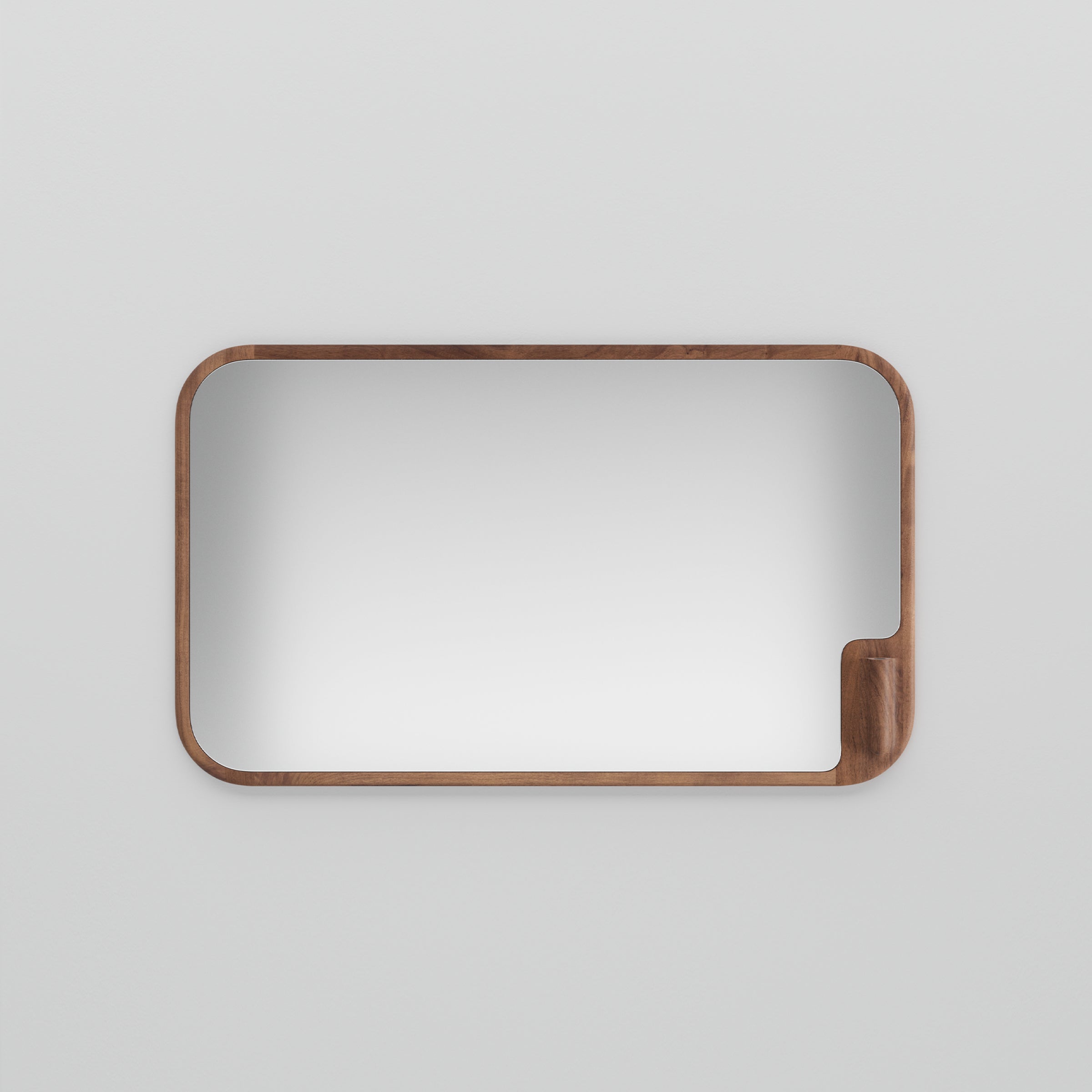 The MUSE Mirror by Artisan is a rectangular design with rounded corners, framed in solid wood against a plain white background. The lower right corner includes a unique wooden indentation, adding an eco-friendly design element.