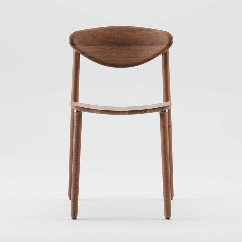 The NARU Chair Light by Artisan is a modern wooden chair with a simple design. Crafted from solid wood, it features a curved backrest, smooth polished finish, four straight legs, and a slightly angled seat. Made with environmentally-friendly materials against a plain white background.