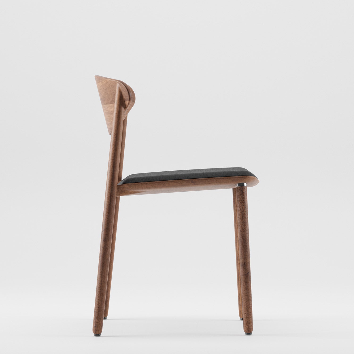 Side view of the NARU Chair Light by Artisan, a minimalist design made from eco-friendly solid wood with natural oil finish. It features a black cushioned seat and slightly angled backrest, all set against a plain white background.