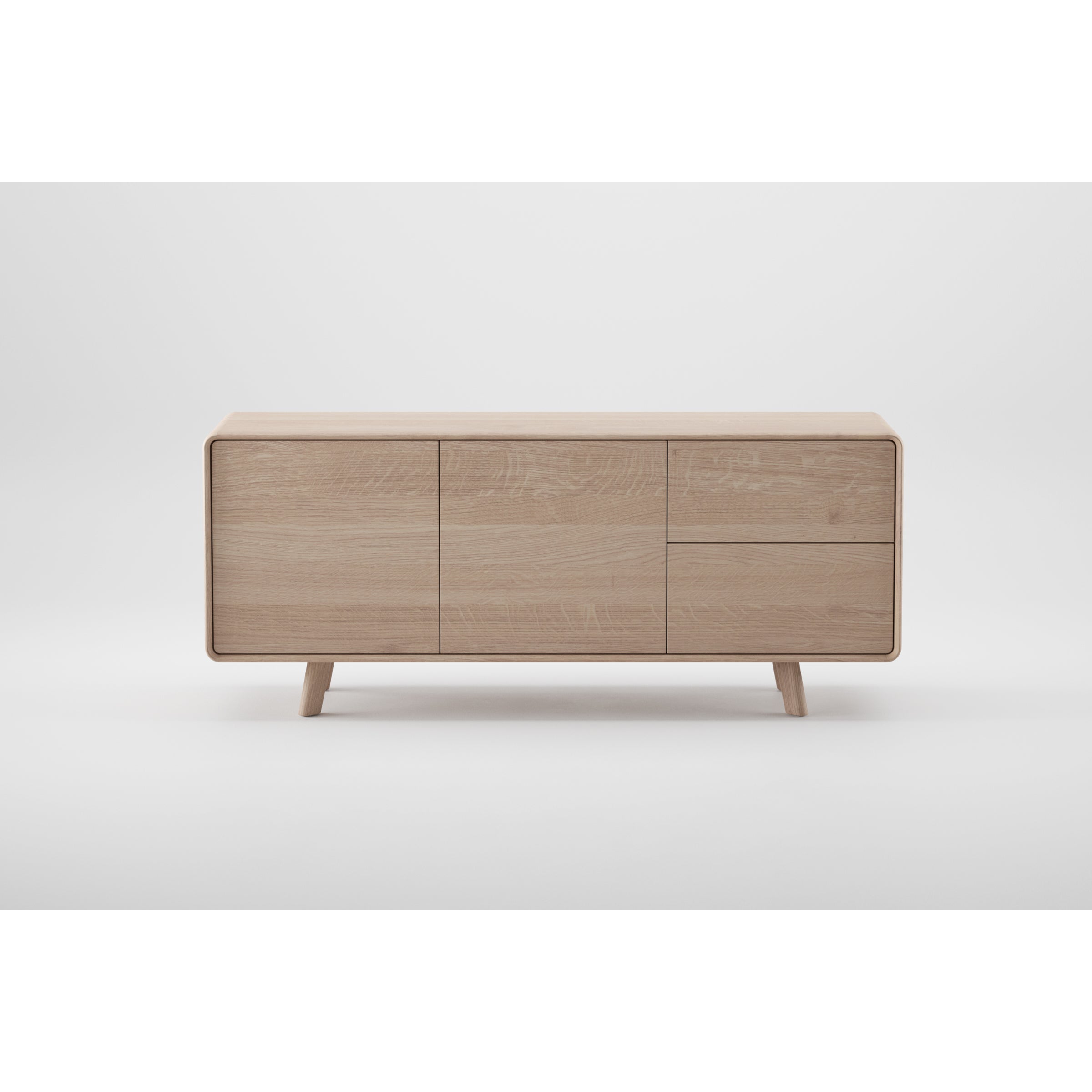 The NEVA Sideboard by Artisan is a handcrafted masterpiece with a minimalist design, featuring a natural light oak facade with three doors on short, angled legs against a white background.