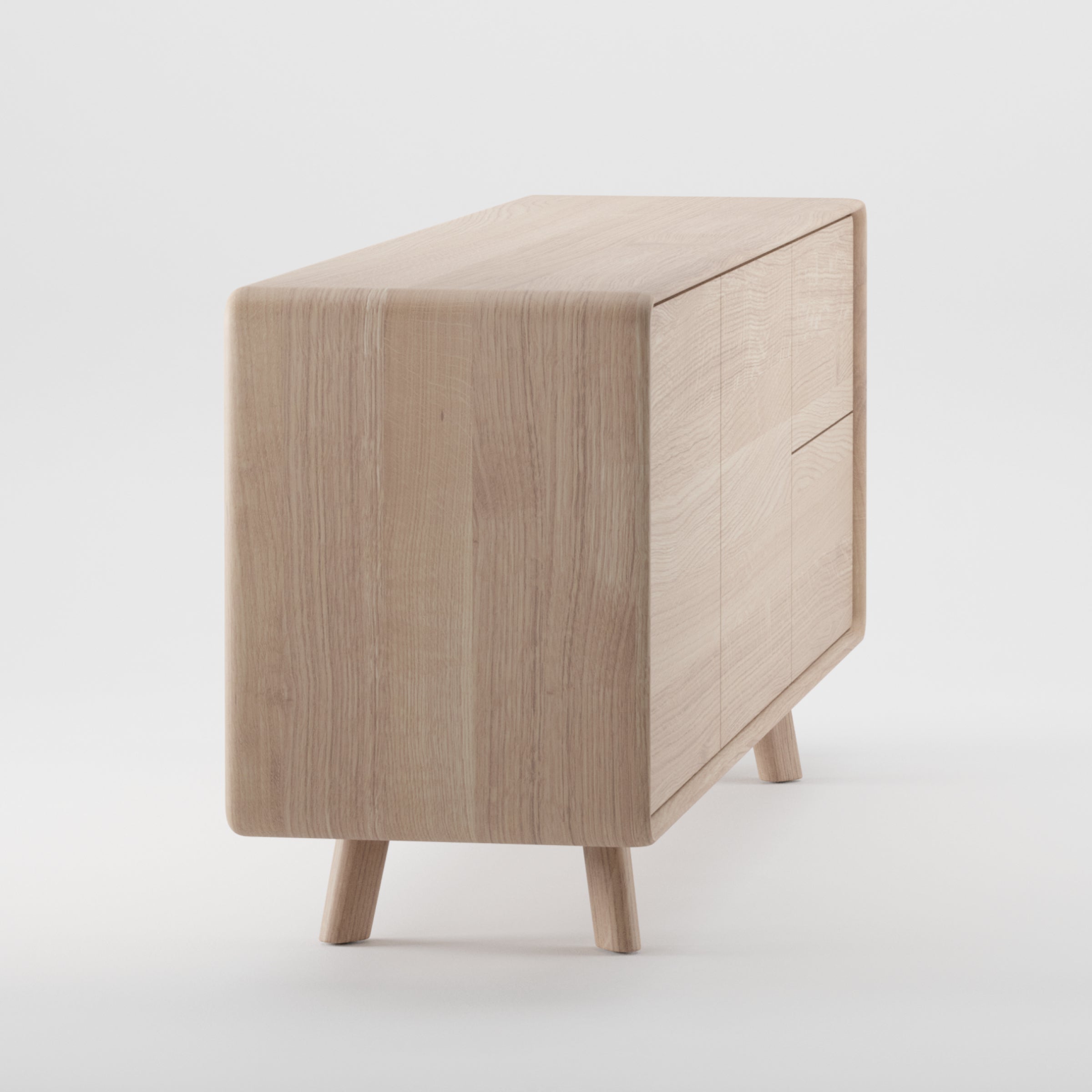 The NEVA Sideboard by Artisan, with its hand-crafted elegance, features smooth rounded edges and three drawers. Its light wood finish and four sturdy legs stand out beautifully against a white background, showcasing its natural artistry.