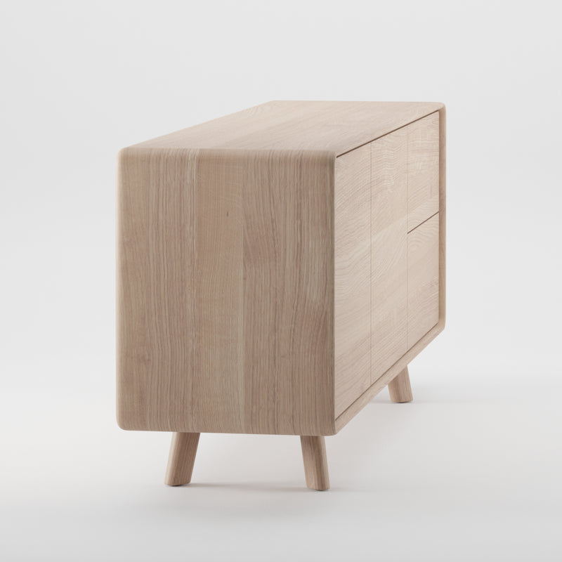 The NEVA Sideboard by Artisan, with its hand-crafted elegance, features smooth rounded edges and three drawers. Its light wood finish and four sturdy legs stand out beautifully against a white background, showcasing its natural artistry.