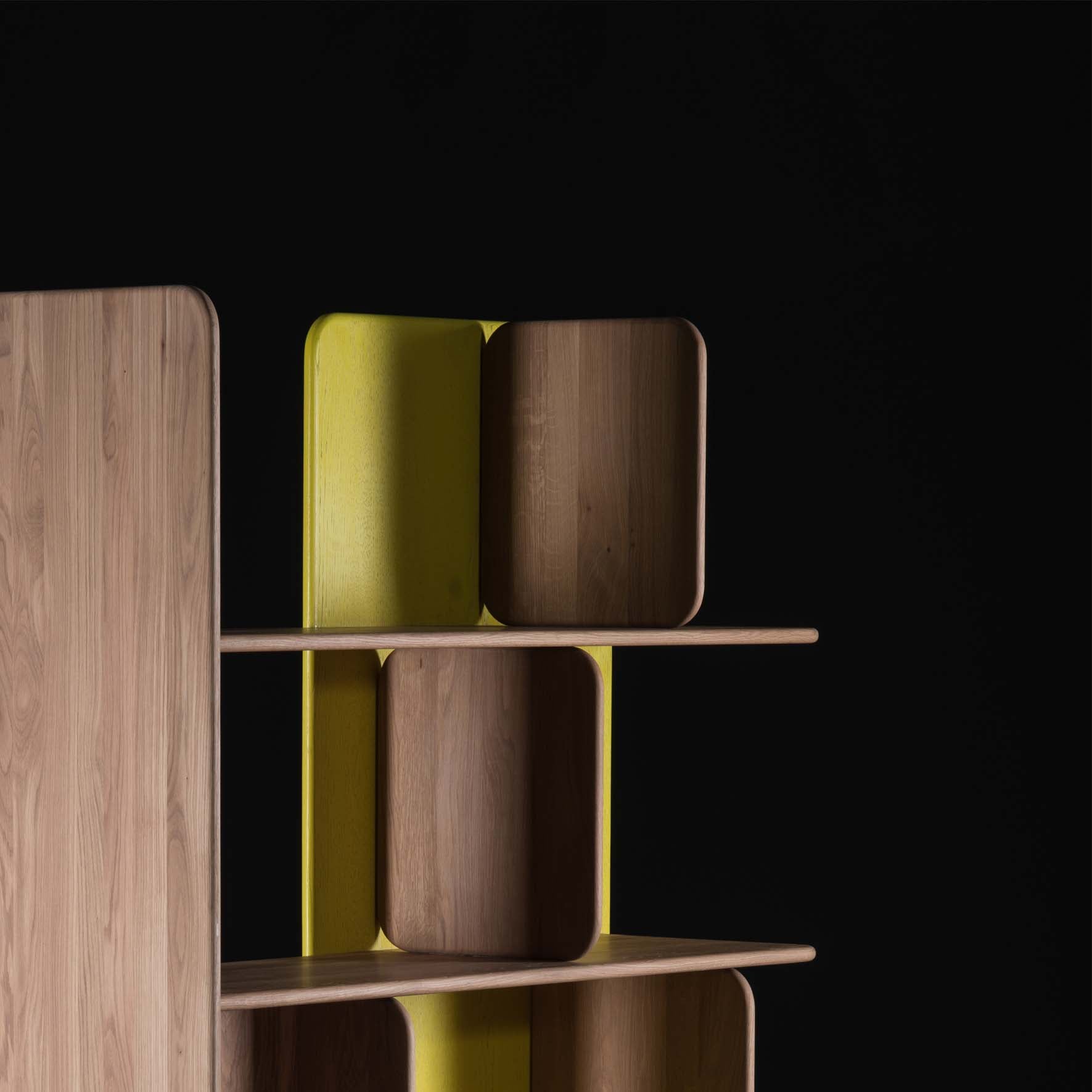 The SOFT Shelf - IVENTORY by Artisan features wooden shelves with rounded edges and a yellow backing against a black background. Made from solid wood, the asymmetrical arrangement adds a modern, artistic touch and showcases the natural finishes beautifully.