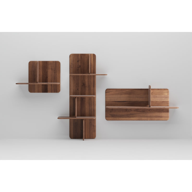 Part of the Artisan Neva collection, the Soft Wall Modules are wooden shelves set against a plain white background. Featuring geometric shapes—a square, a vertical rectangle, and a horizontal rectangle—they offer asymmetric shelving crafted from organic wood for a modern design.