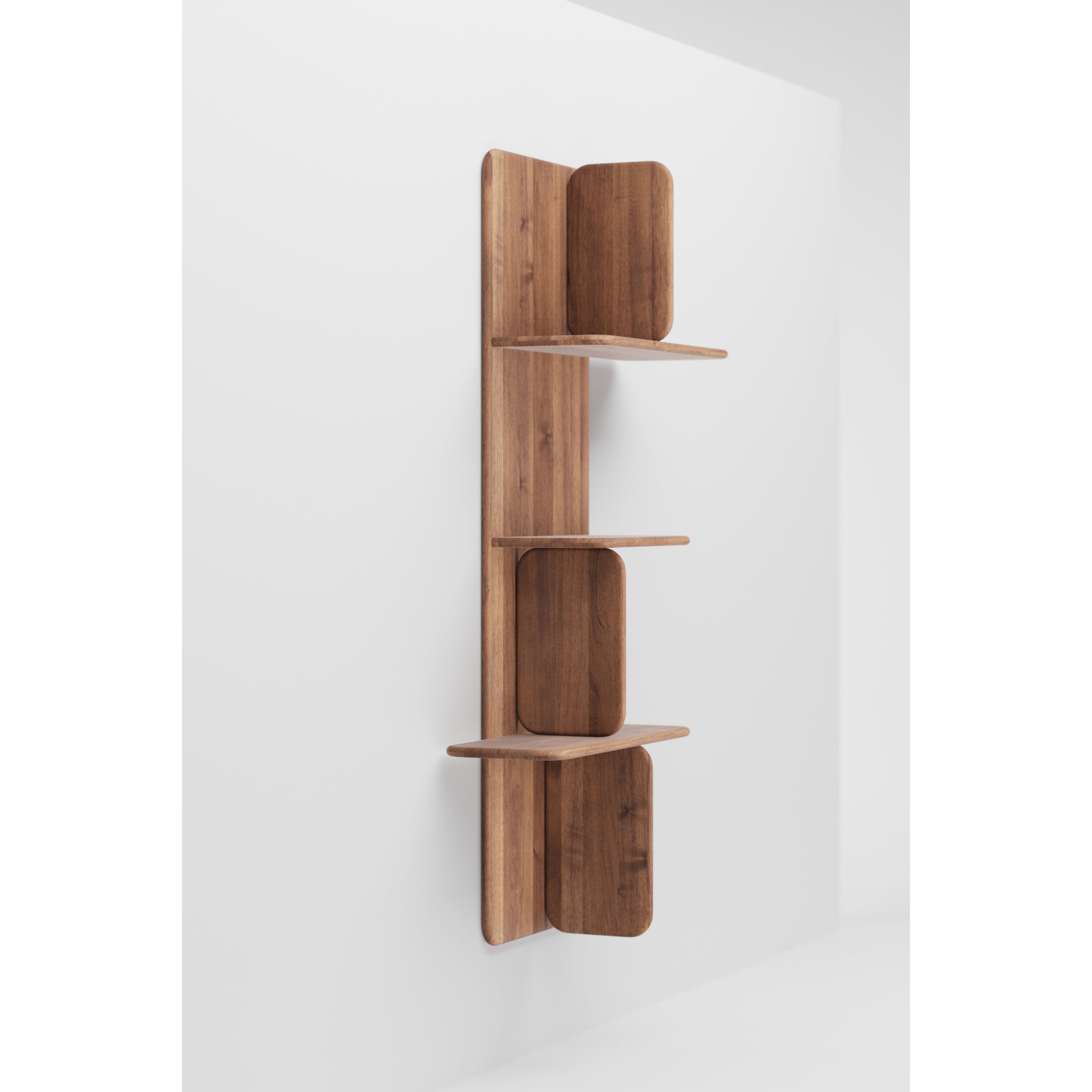 The Soft Wall Modules by Artisan feature a wooden wall-mounted shelf with three vertically aligned tiers. Each has rounded rectangular back panels and is attached to a central plank, highlighting organic materials against a plain white background.