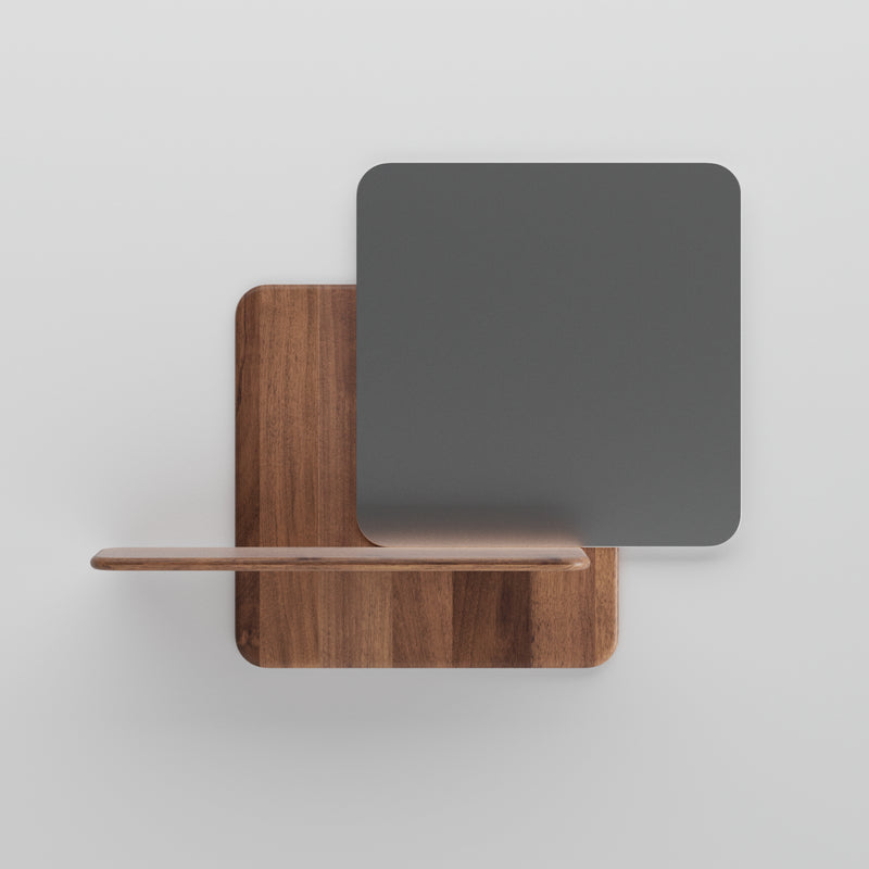 The Artisan Soft Wall Modules offer a minimalist design featuring two overlapping squares: one in organic wood doubling as a small shelf, and one in dark gray, all set against a white background for an elegant touch.