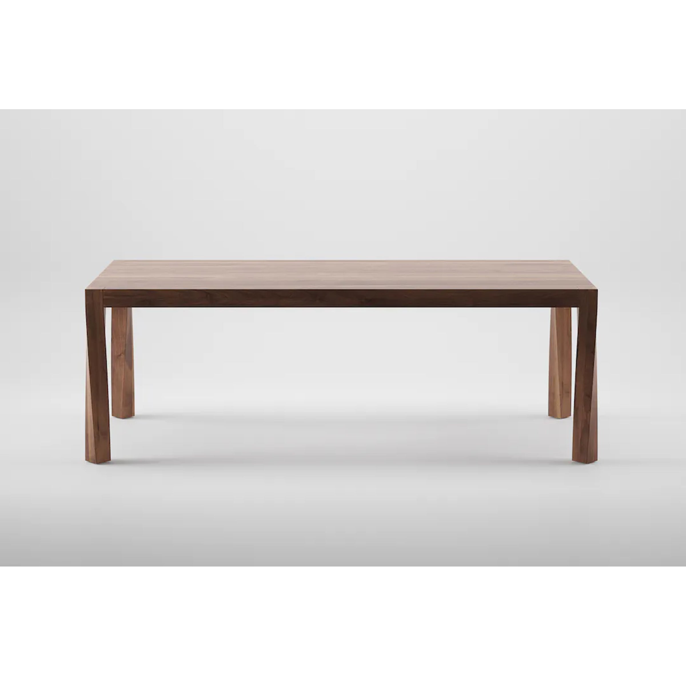 The Artisan TOR Table is a modern rectangular piece crafted from solid wood, featuring clean lines and a smooth surface. Its organic natural finish is beautifully supported by four straight legs, displayed against a plain white background.