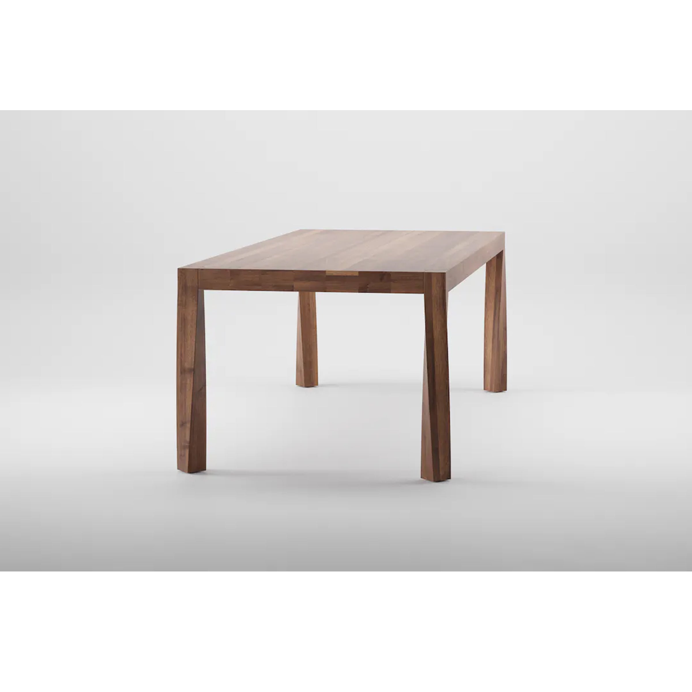 The Artisan TOR Table, a minimalist piece made from solid wood, is centered against a plain white background. Its rectangular top and four straight, slightly angled legs showcase a smooth finish that highlights the organic beauty of its visible grain patterns.