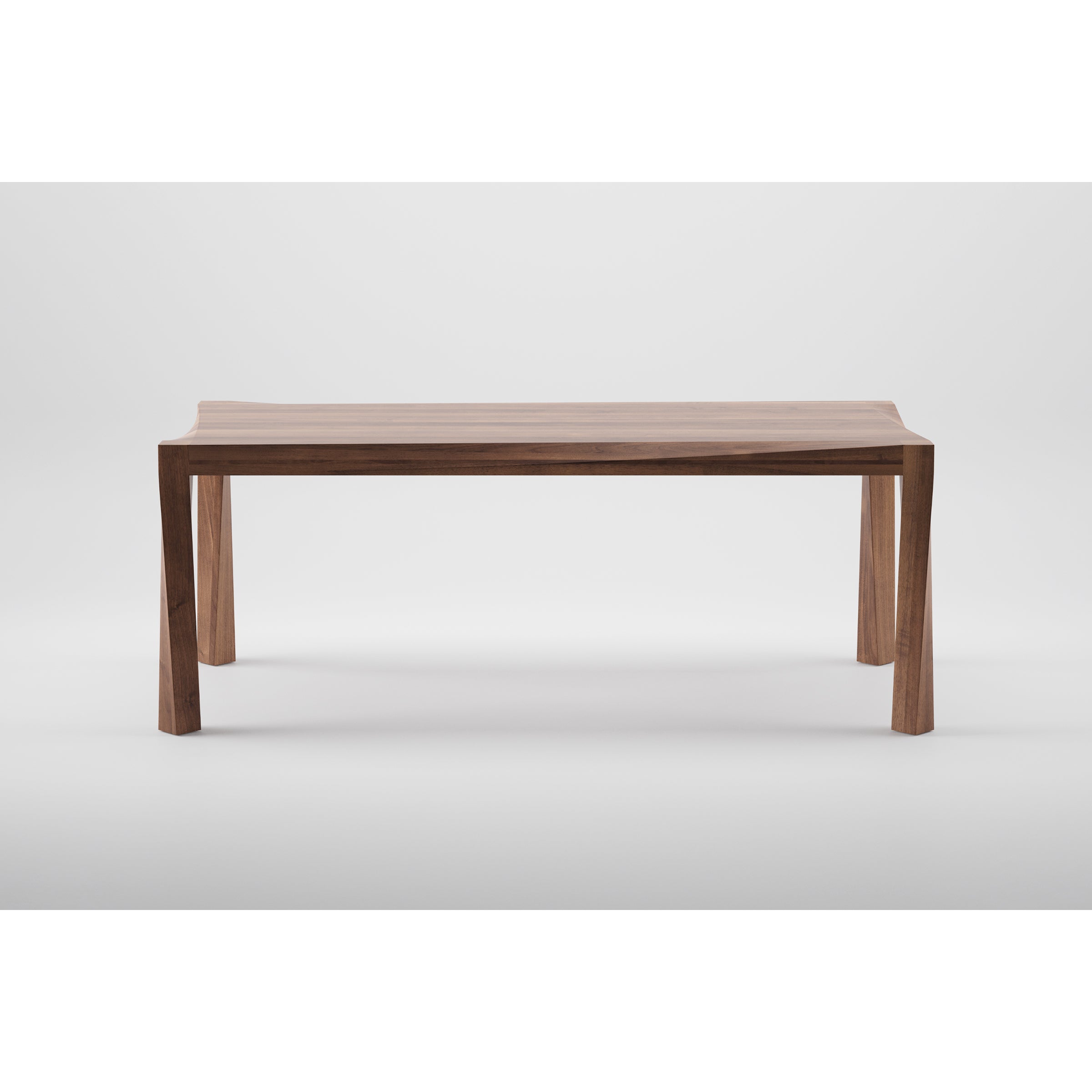The Artisan TORSIO Table is a minimalist eco-friendly table made from solid wood, featuring a smooth flat top and four straight legs. Finished with natural oils to beautifully highlight the grain, it stands against a plain white background, showcasing its simple yet elegant design.