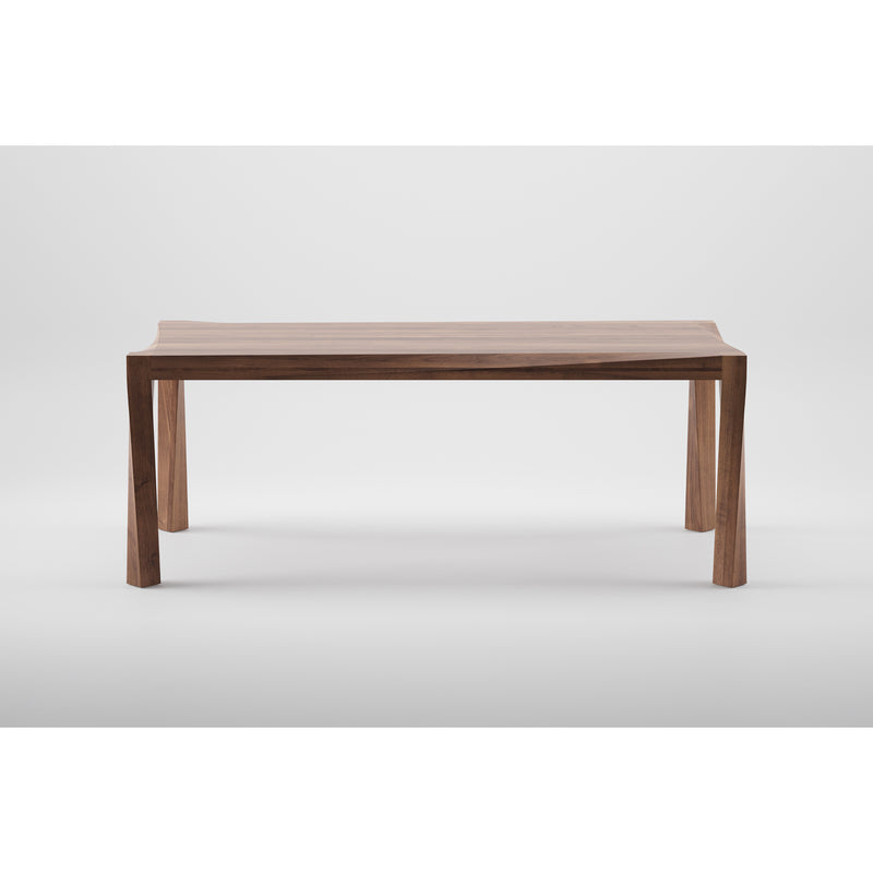 The Artisan TORSIO Table is a minimalist eco-friendly table made from solid wood, featuring a smooth flat top and four straight legs. Finished with natural oils to beautifully highlight the grain, it stands against a plain white background, showcasing its simple yet elegant design.