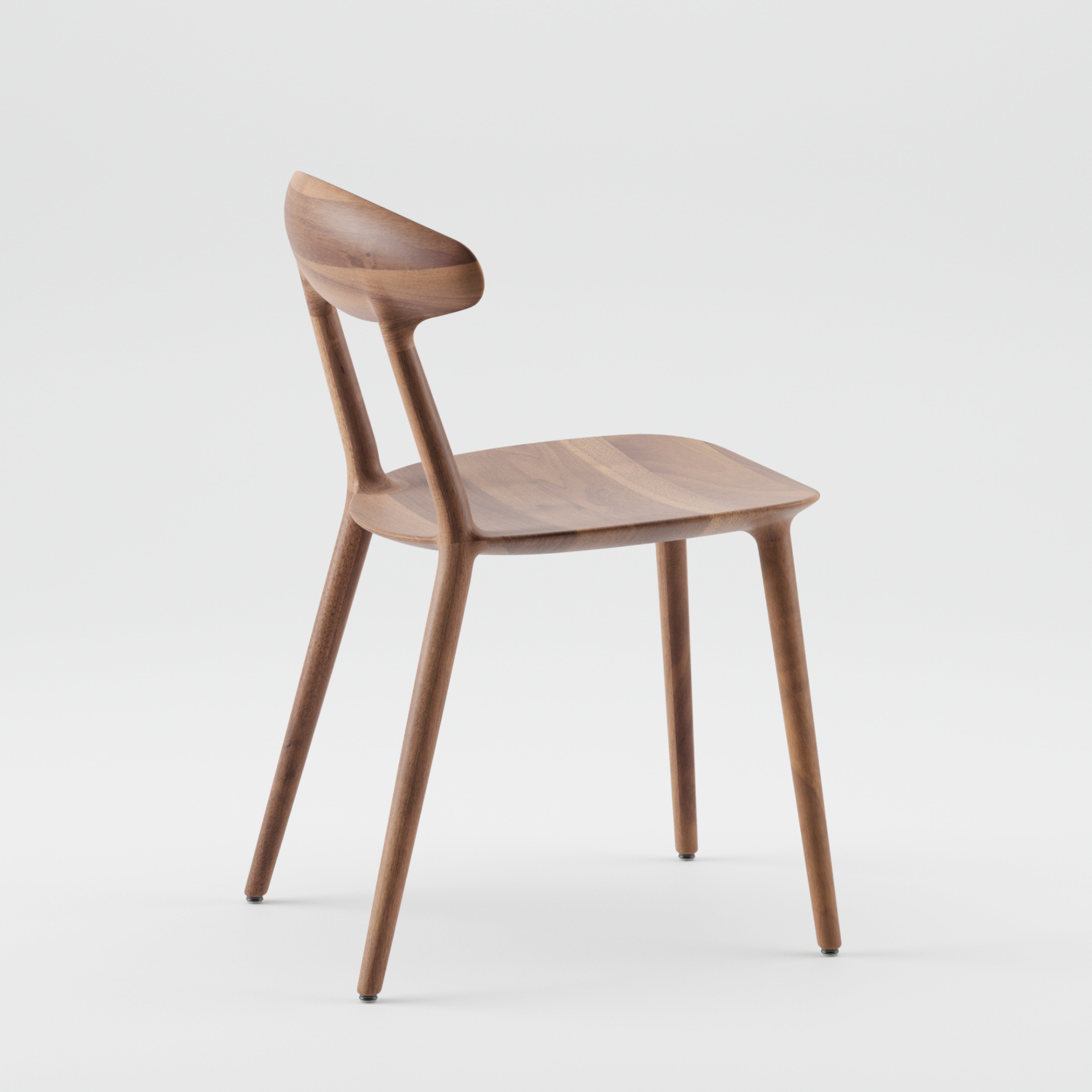 The WU Chair by Artisan is a minimalist wooden chair with a curved backrest, smooth seat, and four slender legs. Made from solid wood, its design boasts natural oils to enhance the rich grain and clean lines, all set against a plain white background.