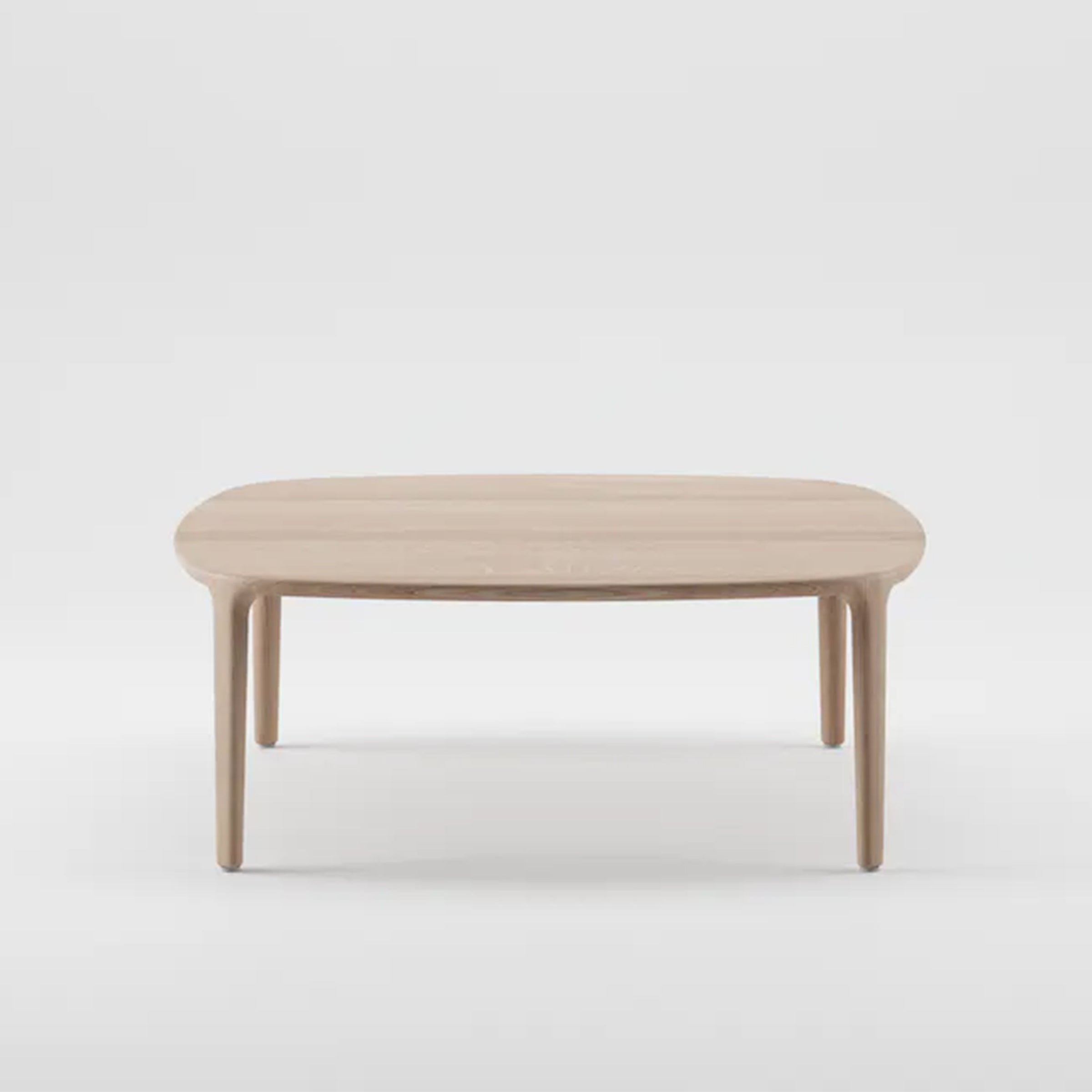 The WU Coffee Table by Artisan features a minimalist design with an oval solid wood top and four straight legs. Highlighted against a plain white background, it boasts a light, natural wood finish using eco-friendly materials.