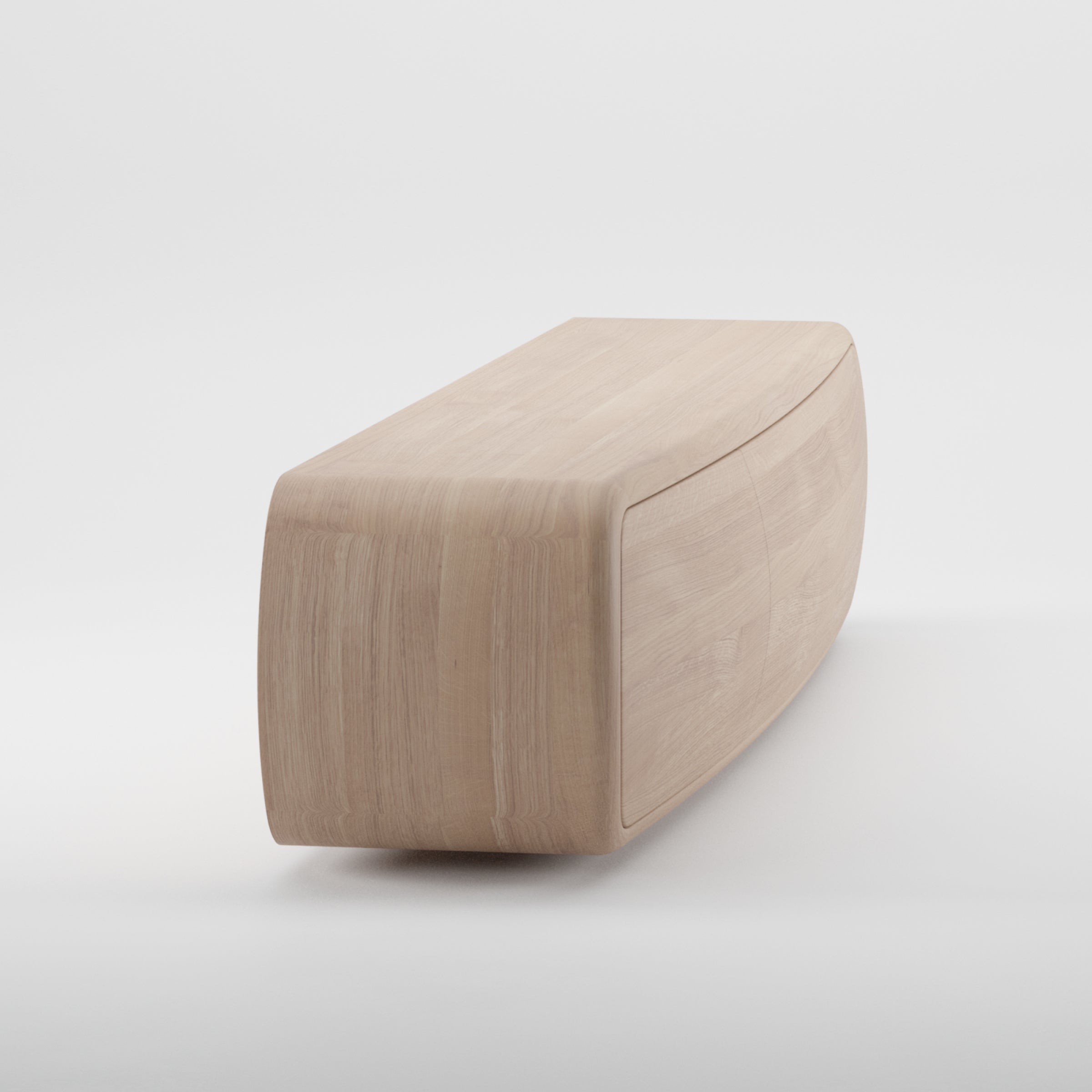 The WU Sideboard by Artisan is a smooth, rectangular solid wood piece with a gracefully curved top surface. Its natural, light finish accentuates the visible wood grain, showcasing the organic beauty of its texture against a white background.