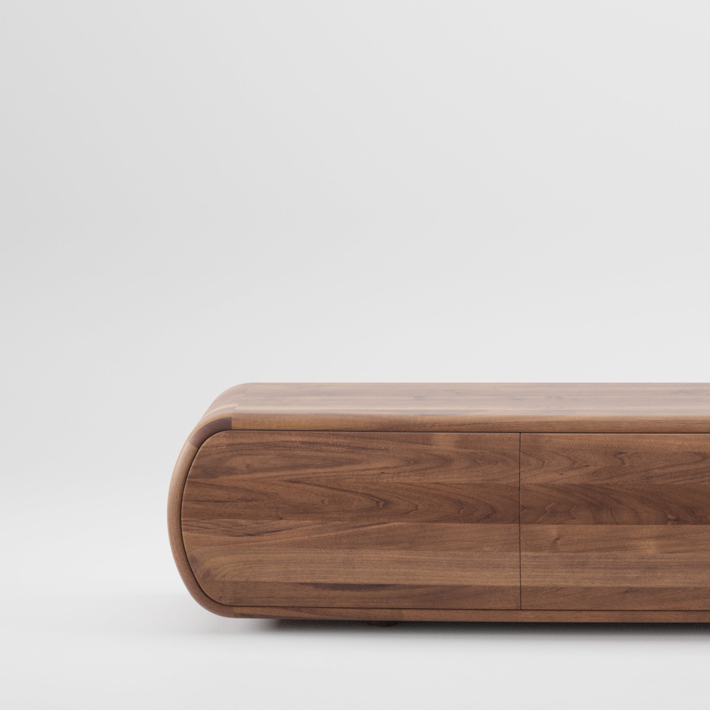 The Artisan WU Sideboard is a sleek, curved wooden cabinet made from solid wood, set against a plain white background. Its minimalist design and smooth finish emphasize the organic beauty of wood texture and rich, natural grain, crafted using environmentally-friendly materials.