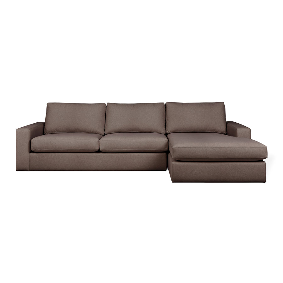 The Ashdale Right-Facing Sectional by Gus Modern features a hardwood frame, three seat and backrest cushions, a right-side chaise lounge, wide armrests, and plush synthetic-down cushions for modern minimalist comfort.