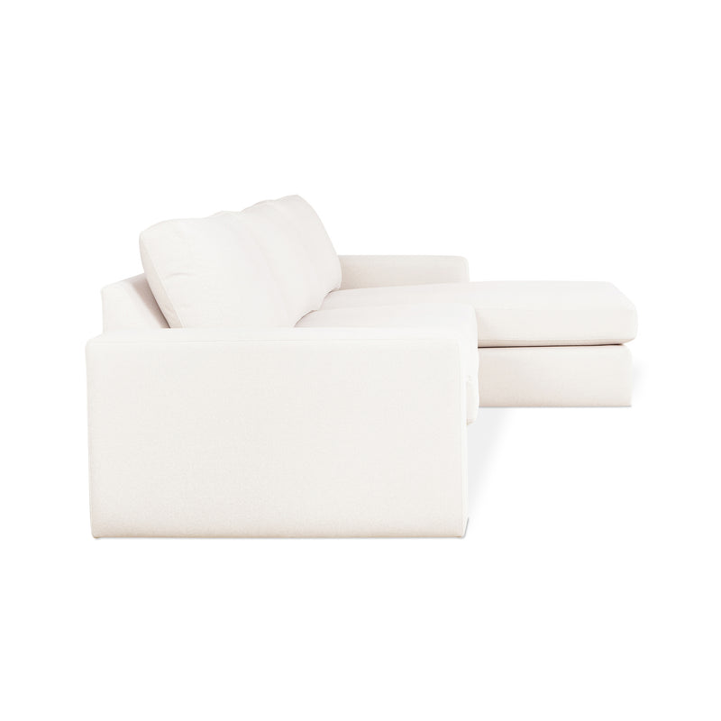 The Gus Modern Ashdale Right-Facing Sectional is a minimalist sofa with synthetic-down cushions and a right-side chaise, shown at an angle against a plain white background.
