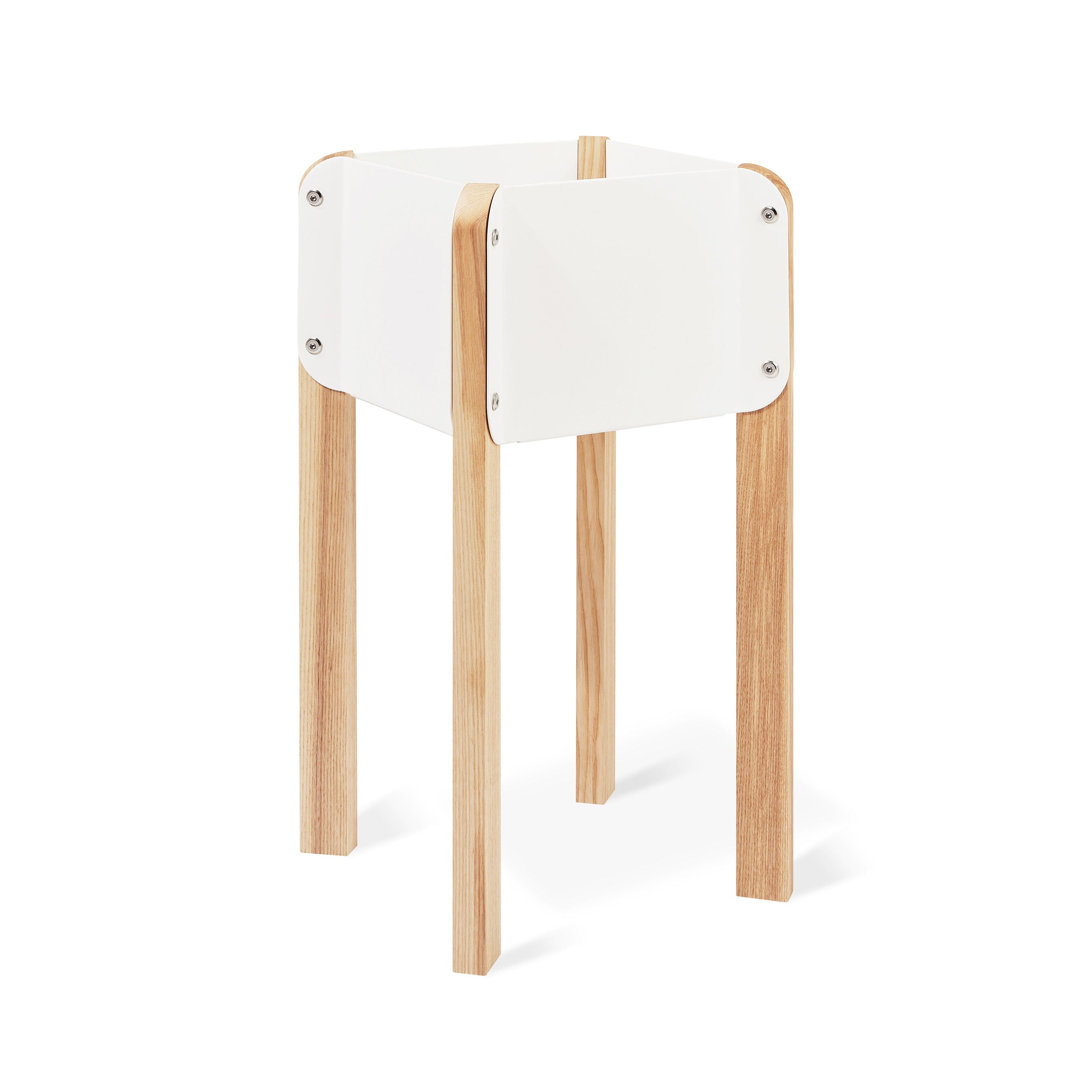 The Atrium Planter Hi by Gus Modern features a modern, minimalist design with four light wood legs and a square white frame inspired by Bauhaus style, shown against a white background.