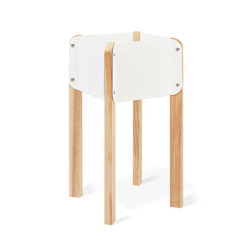 The Atrium Planter Hi by Gus Modern features a modern, minimalist design with four light wood legs and a square white frame inspired by Bauhaus style, shown against a white background.