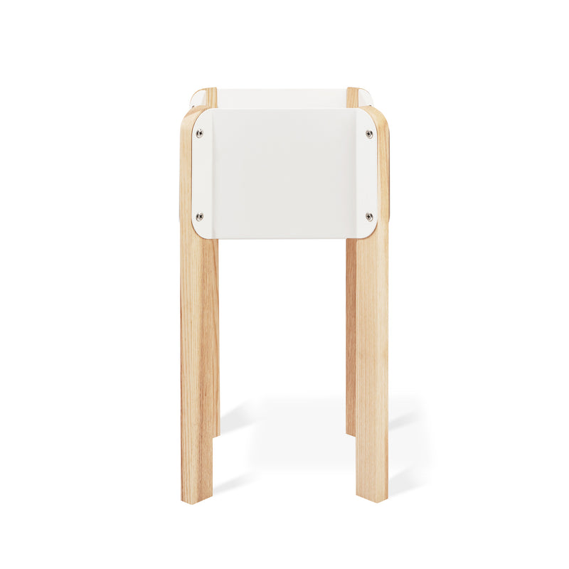 The Atrium Planter Hi by Gus Modern is a Bauhaus-inspired white rectangular planter with four light wooden legs, shown against a plain white background.