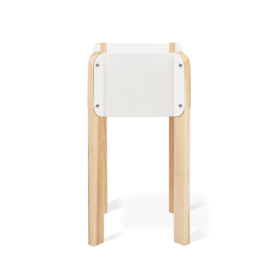 The Atrium Planter Hi by Gus Modern is a Bauhaus-inspired white rectangular planter with four light wooden legs, shown against a plain white background.