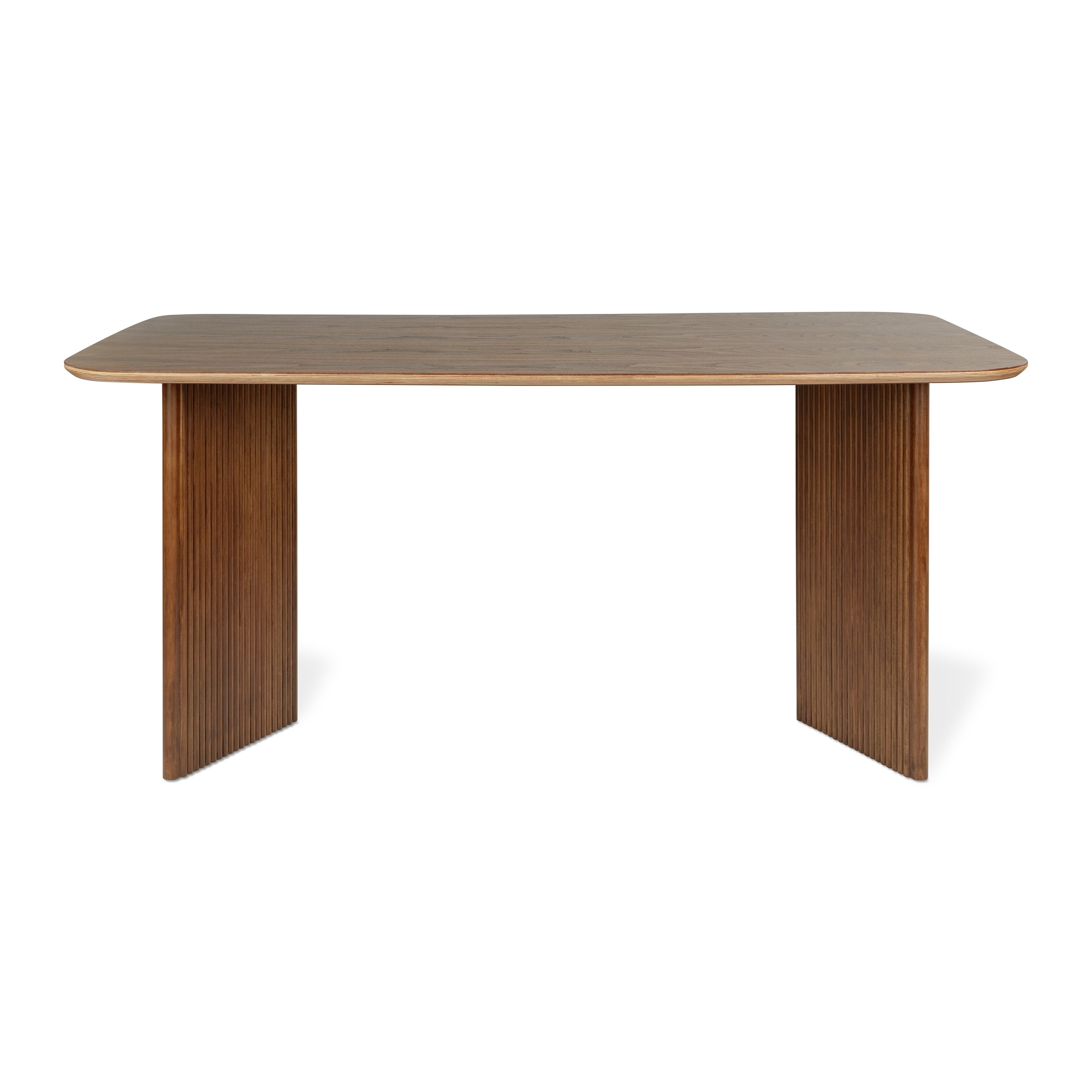 The Atwell Dining Table Rectangle by Gus Modern features solid wood construction, rounded corners, and two wide, vertically grooved end legs. Its simple, modern lines are inspired by Mid-Century Scandinavian design.
