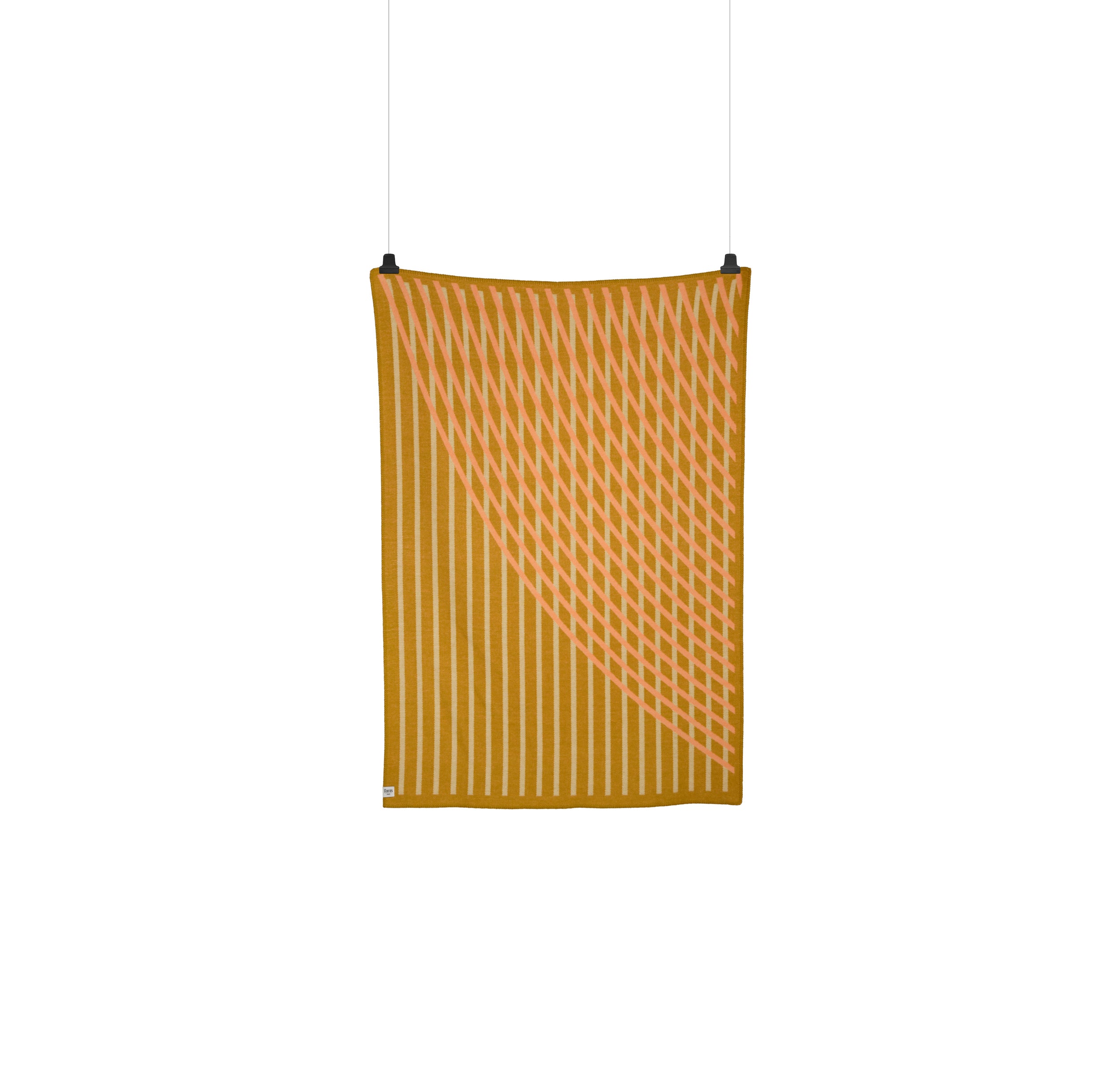 The BISLETT Throw by Roros is a vertically hanging textile made of Norwegian lambswool, with a geometric pattern featuring diagonal lines in mustard yellow and soft pink that evoke a Moiré wave effect against a plain white background.