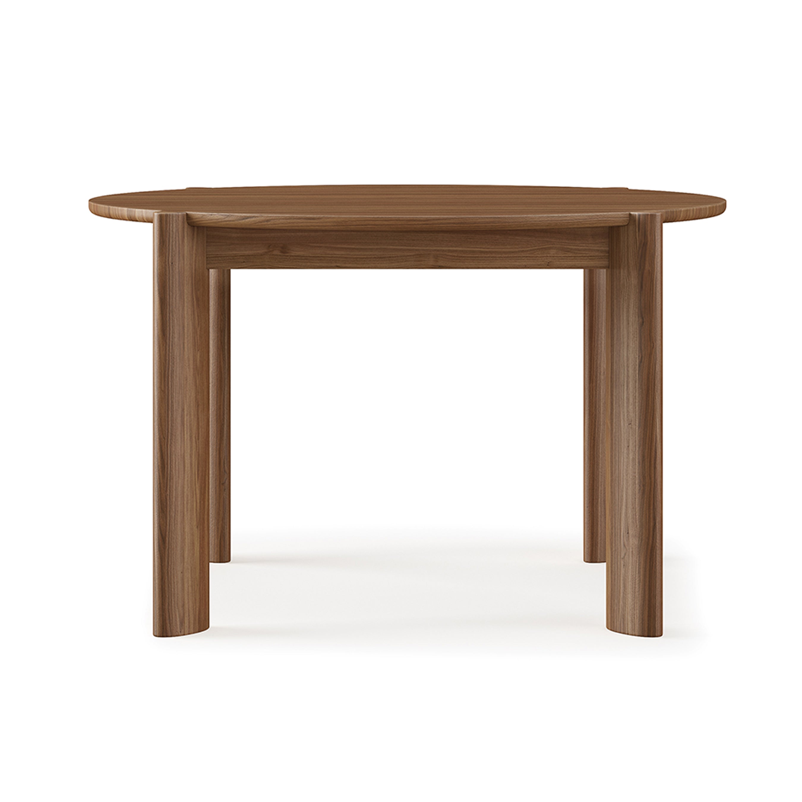 The Bancroft Dining Table Round by Gus Modern is a solid wood dining table with a smooth surface and four thick, cylindrical legs, shown against a plain white background.