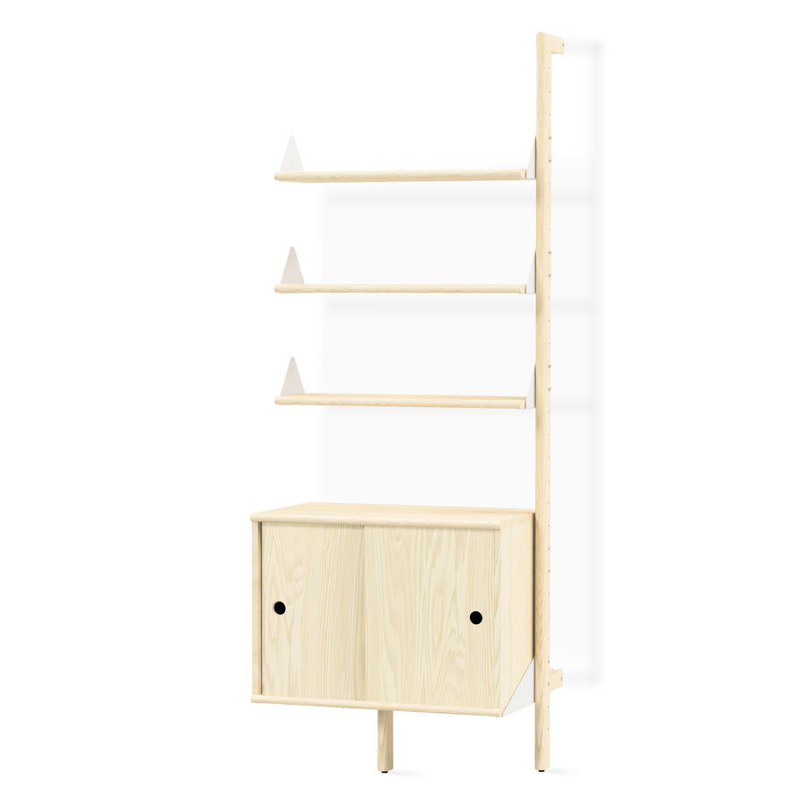 The Gus Modern Branch Storage Unit Add-On is a modular light wood shelving unit with three open shelves and a two-door cabinet below, featuring a minimalist design perfect for organization.