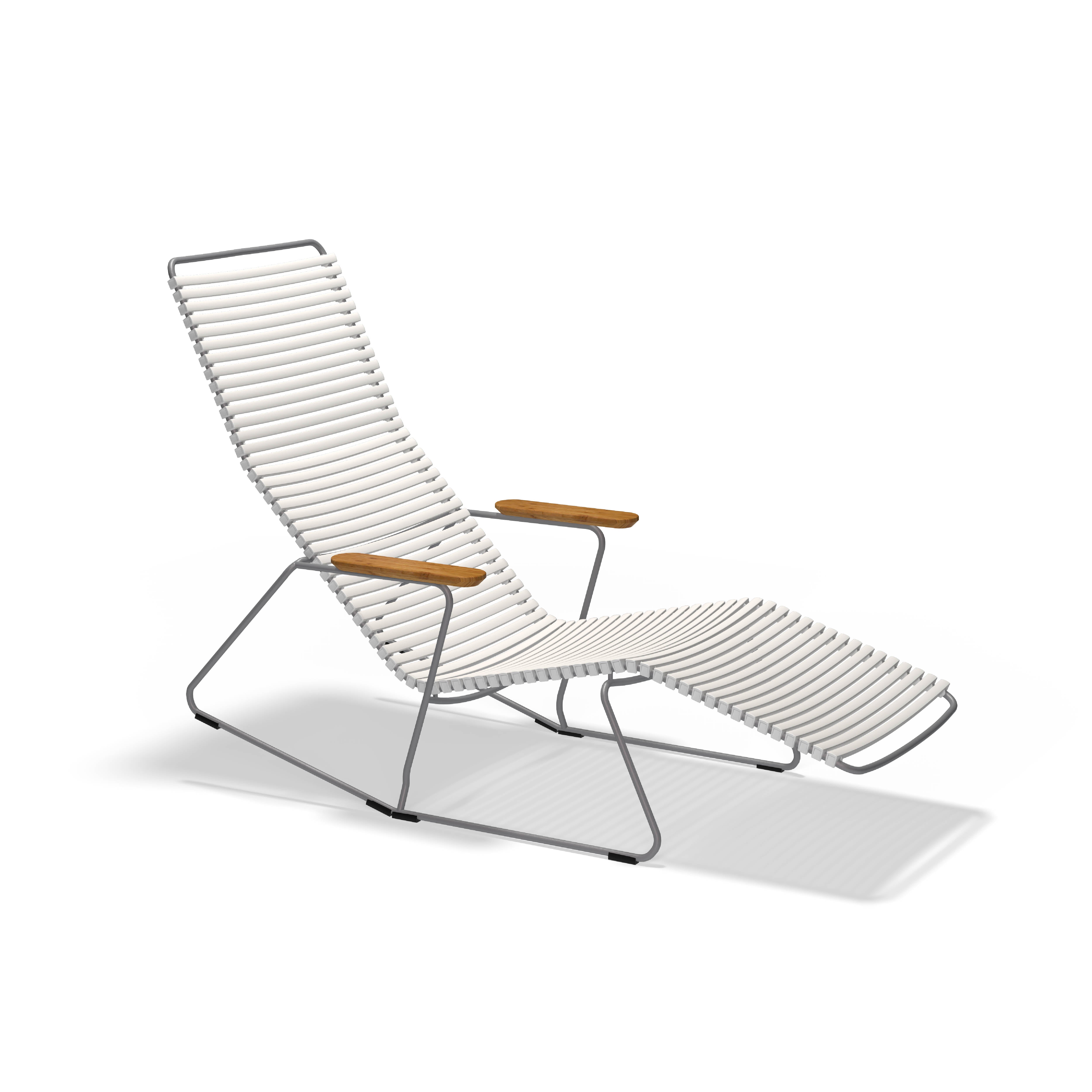 The Click Sunrocker by Houe is a modern lounge chair with a sleek design. It features a powder-coated steel tubular frame and white ribbed padding, complemented by wooden armrests and a slightly reclined backrest, creating a minimalist and comfortable aesthetic against a plain white background.