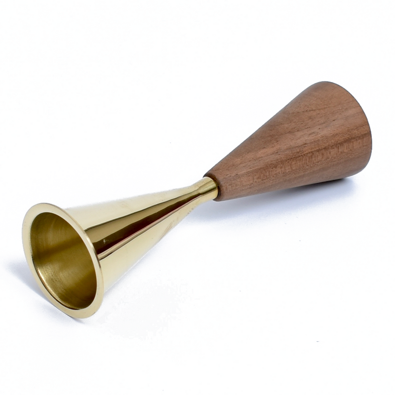 The Snuffer #3471 by Werkstätte Carl Auböck features a dual conical design in polished gold-colored brass and smooth wood, ideal for measuring spirits.