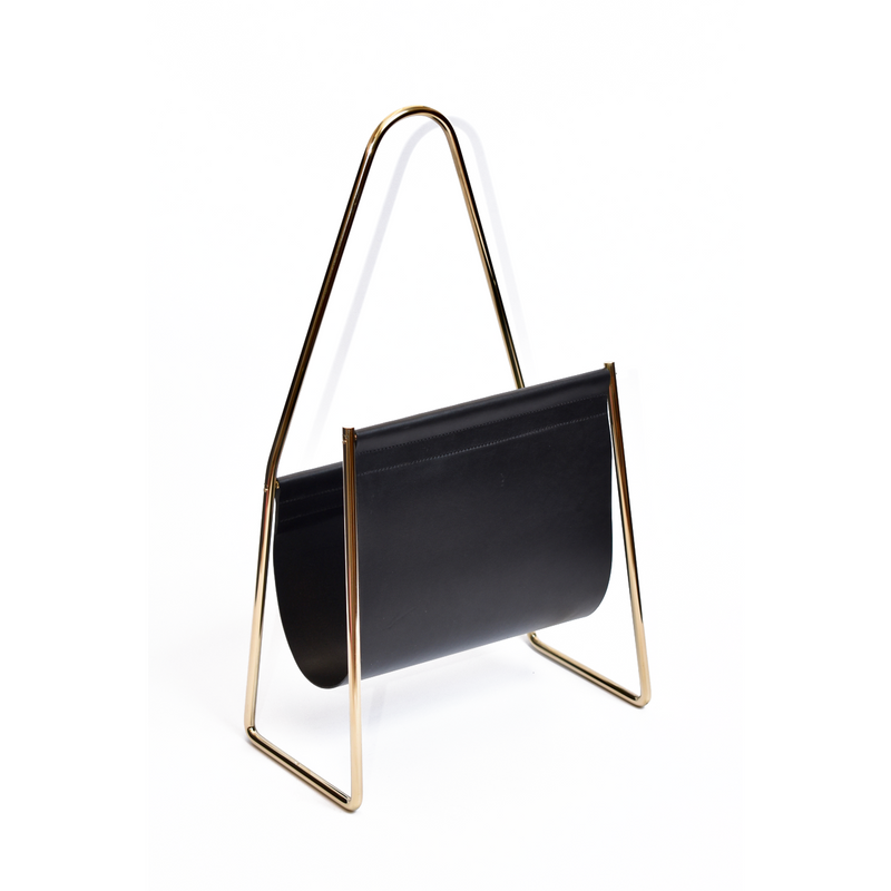 The Magazine Rack #3808 by Werkstätte Carl Auböck boasts an elegant black leather pocket suspended between brass polished golden metal frames, combining modern aesthetics and functionality for a stylish addition to contemporary interiors.
